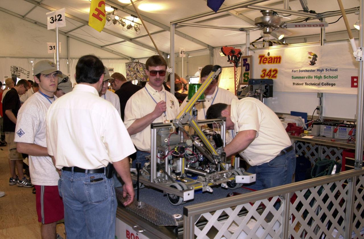 Getting ready for preliminary heats, students and mentors prepare their team robot to compete in the  NASA_KSC FIRST Southeastern Regional event. Team 342, shown here, is known as the “Burning Magnetos,” from Summerville High School in North, S. Carolina.   FIRST (For Inspiration and Recognition of Science and Technology) events are held nationwide, pitting robots against each other and the clock on a playing field.   Many teams are sponsored by corporations and academic institutions. There are 27 teams throughout the State of Florida who are competing.   KSC, which sponsors nine teams, has held the regional event for two years.