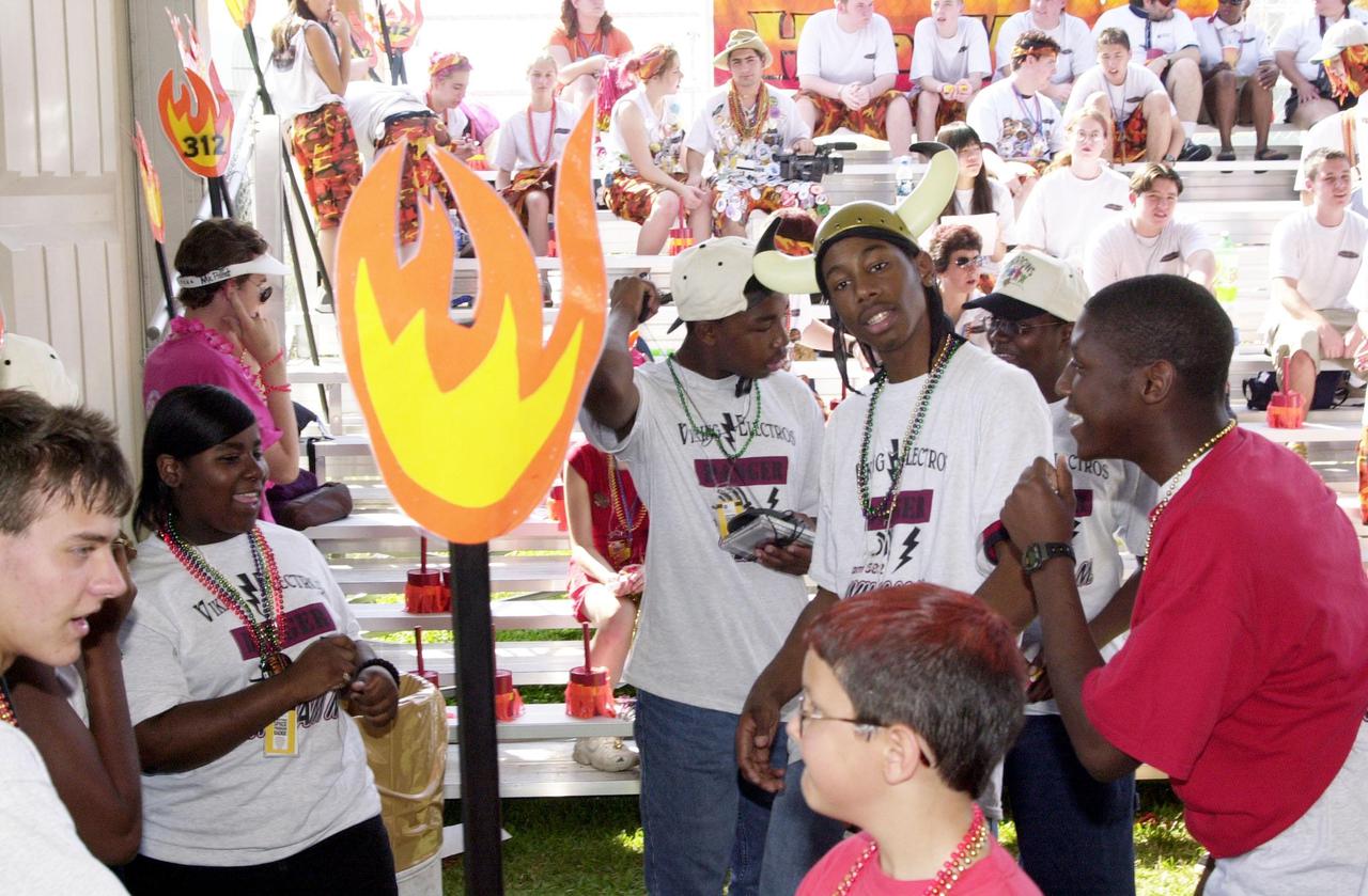 The student team Viking Electros, from W.M. Raines High School, Jacksonville, Fla., relaxes between heats at the NASA_KSC FIRST Southeastern Regional event held March 1-3, 2001. FIRST (For Inspiration and Recognition of Science and Technology) events are held nationwide, pitting robots against each other and the clock on a playing field. Many teams are sponsored by corporations and academic institutions. There are 27 teams throughout the State of Florida who are competing. KSC, which sponsors nine teams, has held the regional event for two years