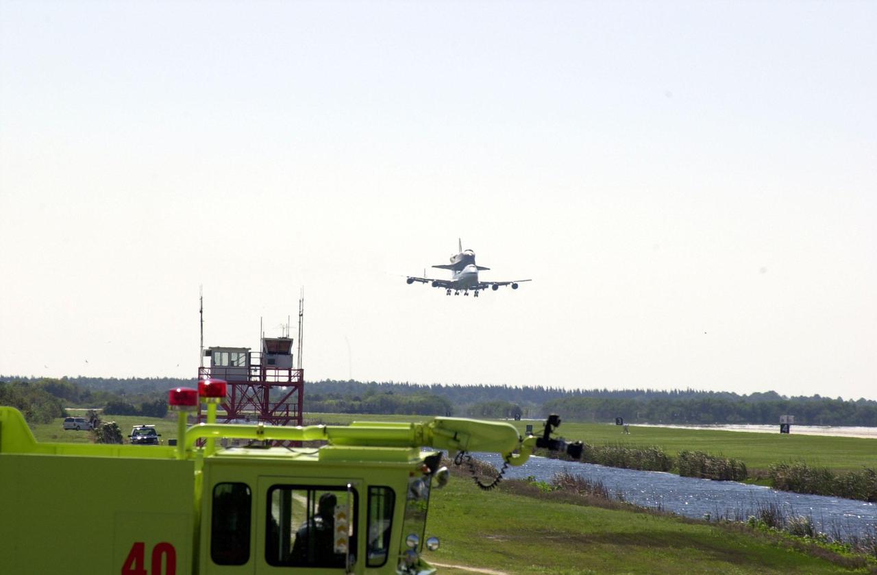 KENNEDY SPACE CENTER, FLA. -- The orbiter Atlantis arrives at KSC’s Shuttle Landing Facility riding piggyback on a Shuttle Carrier Aircraft, a modified Boeing 747. Atlantis landed in California Feb. 19 concluding mission STS-98. The ferry flight began in California March 1; unfavorable weather conditions kept it on the ground at Altus AFB, Okla., until it could return to Florida. The orbiter will next fly on mission STS-104, the 10th construction flight to the International Space Station, scheduled June 8