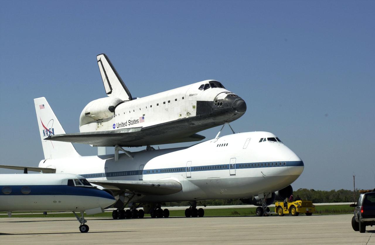 KENNEDY SPACE CENTER, FLA. -- The Shuttle Carrier Aircraft, with its piggyback cargo the orbiter Atlantis, heads for the mate_demate device after landing at the KSC Shuttle Landing Facility. Atlantis landed in California Feb. 19 concluding mission STS-98. The ferry flight began in California March 1; unfavorable weather conditions kept it on the ground at Altus AFB, Okla., until it could return to Florida. The orbiter will next fly on mission STS-104, the 10th construction flight to the International Space Station, scheduled June 8