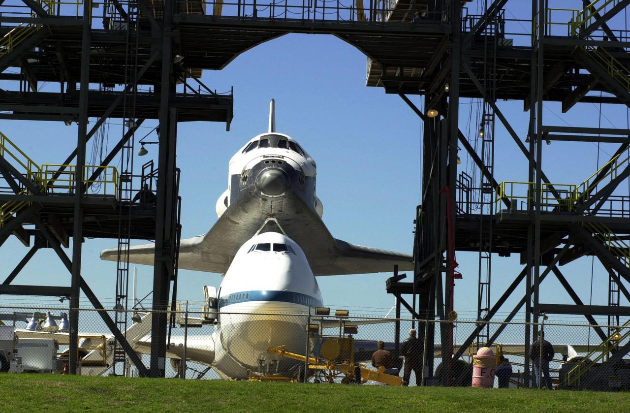 KENNEDY SPACE CENTER, FLA. -- The orbiter Atlantis, atop a Shuttle Carrier Aircraft, comes to a stop at the mate_demate device at the KSC Shuttle Landing Facility after a protracted trip from California. Atlantis landed in California Feb. 19 concluding mission STS-98. The ferry flight began March 1; unfavorable weather conditions kept it on the ground at Altus AFB, Okla., until it could return to Florida. The orbiter will next fly on mission STS-104, the 10th construction flight to the International Space Station, scheduled June 8