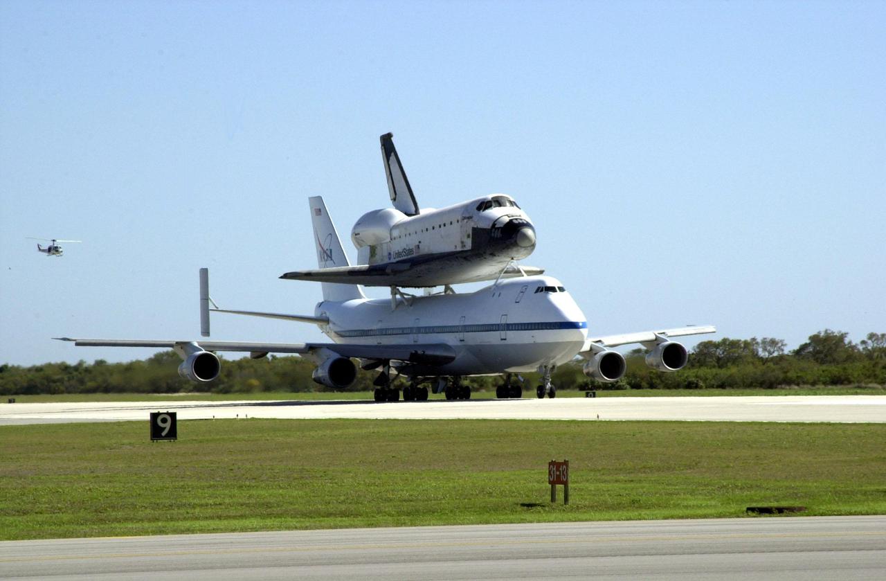KENNEDY SPACE CENTER, FLA. -- The orbiter Columbia, atop a Shuttle Carrier Aircraft, taxis on the runway at the Cape Canaveral Air Force Station Skid Strip. The ferry flight began in California March 1. Unfavorable weather conditions kept it on the ground at Dyess AFB, Texas, until it could return to Florida. Columbia is returning from a 17-month-long modification and refurbishment process as part of a routine maintenance plan. The orbiter will next fly on mission STS-107, scheduled Oct. 25
