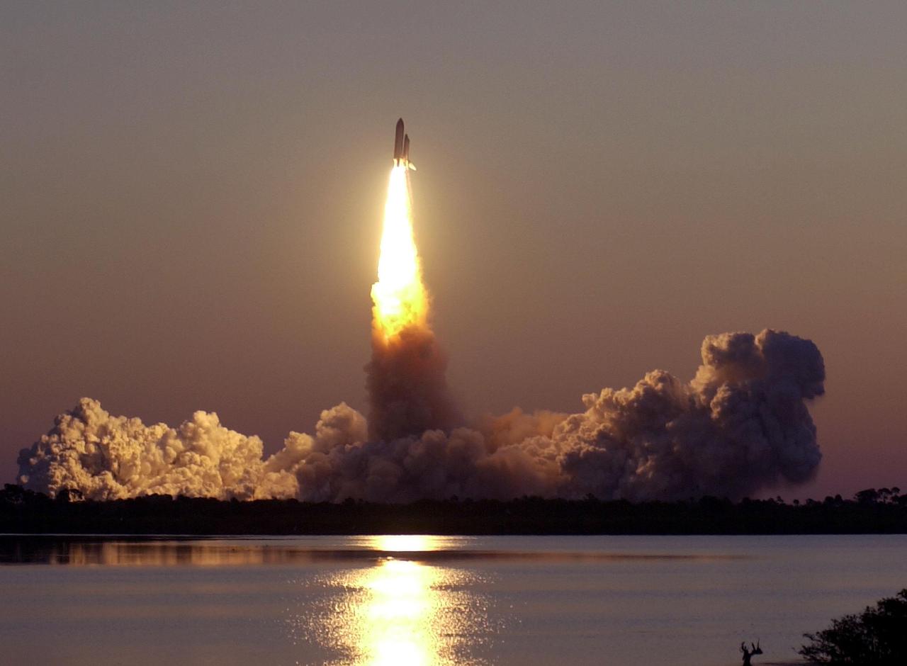 KENNEDY SPACE CENTER, Fla. -- Viewed from Astronaut Rd., Space Shuttle Discovery breaks away from the cocoon of smoke below, blazing a trail into the dawn sky. Liftoff of Discovery on mission STS-102 occurred at 6:42:09 EST on the eighth flight to the International Space Station