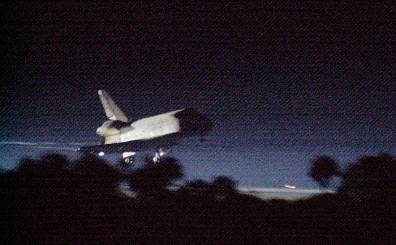 KENNEDY SPACE CENTER, Fla. -- Getting a break in the weather, Space Shuttle Discovery prepares to land at the KSC Shuttle Landing Facility March 21, on runway 15. Main gear touchdown occurred at 2:31:42 a.m. EST, nose wheel touchdown at 2:31:54 a.m., and wheel stop at 2:33:06 a.m. The landing on orbit 201 concluded mission STS-102, the eighth flight to the International Space Station, carrying the first Multi-Purpose Logistics Module Leonardo, to the ISS and Expedition Two, a replacement crew for the Station. The 12-day, 19-hour, 51-minute mission returned both the Leonardo; and the first resident crew of the ISS, Expedition One, to KSC. Discovery logged 5.3 million miles on this mission. The landing marked the 54th at KSC in the history of the program, and the 12th night landing at KSC