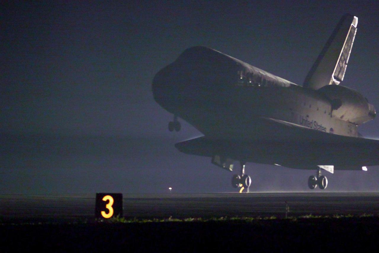 KENNEDY SPACE CENTER, Fla. -- Space Shuttle Discovery approaches touchdown on runway 15 at the KSC Shuttle Landing Facility. Main gear touchdown occurred at 2:31:42 a.m. EST, nose wheel touchdown at 2:31:54 a.m., and wheel stop at 2:33:06 a.m. The landing on orbit 201 concluded mission STS-102, the eighth flight to the International Space Station, carrying the first Multi-Purpose Logistics Module Leonardo, to the ISS and Expedition Two, a replacement crew for the Station. The 12-day, 19-hour, 51-minute mission returned both the Leonardo and the first resident crew of the ISS, Expedition One, to KSC . Discovery logged 5.3 million miles on this mission. The landing marked the 54th at KSC in the history of the program, and the 12th night landing at KSC