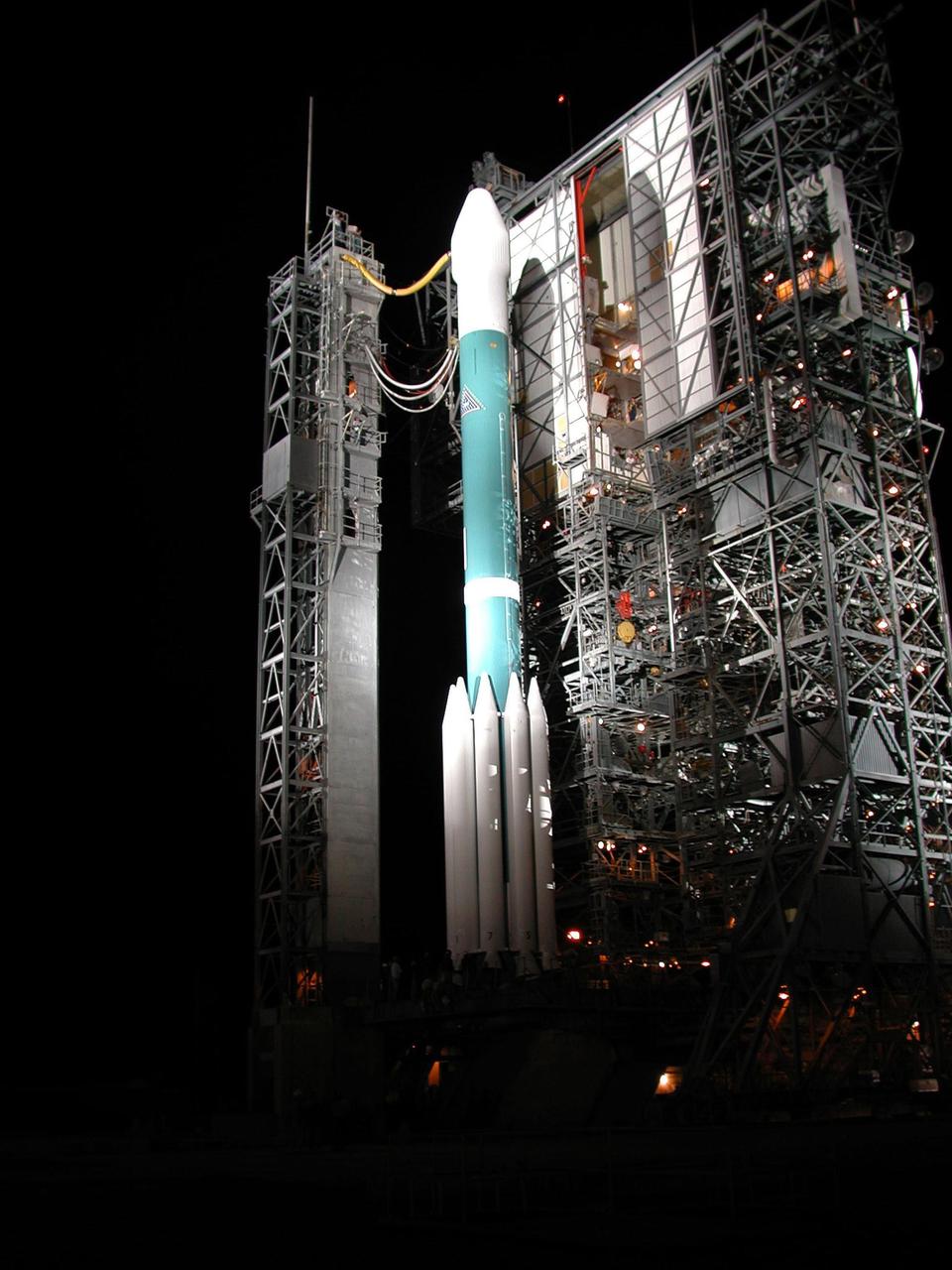 On Launch Complex 17, Cape Canaveral Air Force Station, the tower pulls away from the Boeing Delta II rocket carrying the 2001 Mars Odyssey spacecraft. Liftoff is scheduled for 11:02 a.m. EDT from Launch Complex 17-A at Cape Canaveral Air Force Station. After an approximate 7-month journey, Mars Odyssey will orbit the planet Mars. The spacecraft, built by Lockheed Martin Space Systems for the Jet Propulsion Laboratory, will map the Martian surface looking for geological features that could indicate the presence of water, now or in the past. Science gathered by three science instruments on board will be key to future missions to Mars, including orbital reconnaissance, lander and human missions