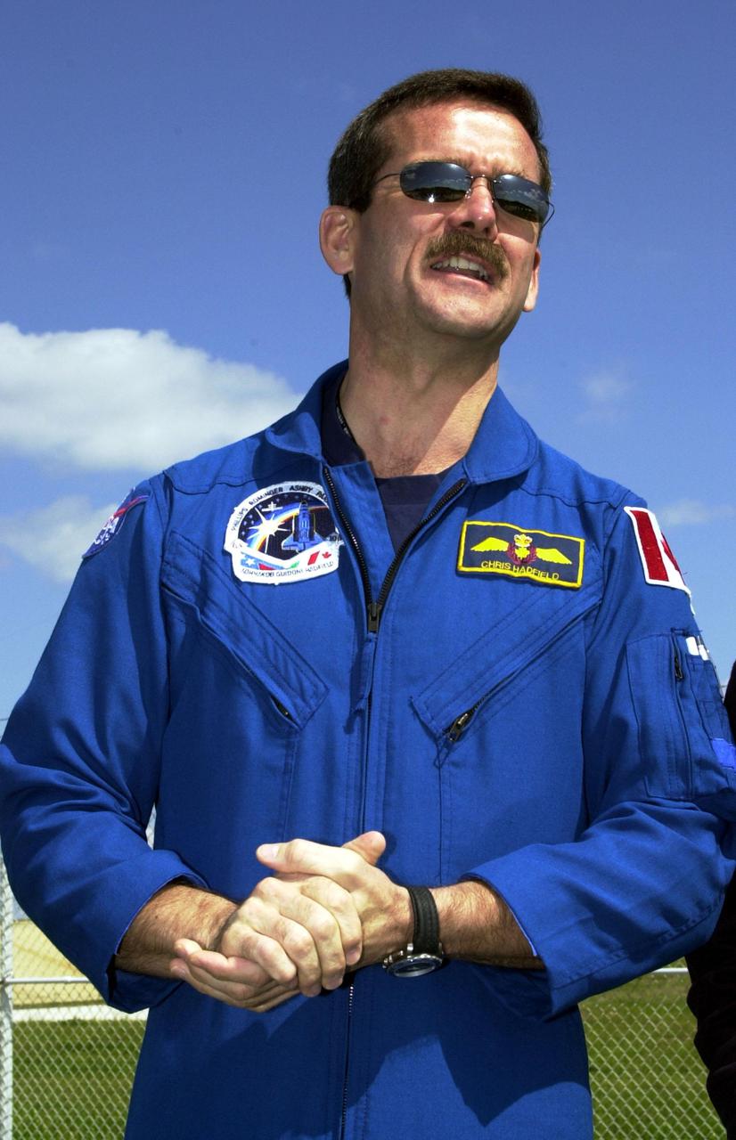 KENNEDY SPACE CENTER, FLA. -- STS-100 Mission Specialist Chris A. Hadfield stands near Launch Pad 39A to greet family and friends. Hadfield is with the Canadian Space Agency. The crew is at KSC to complete final flight plan reviews in anticipation of launch. The 11-day mission to the International Space Station will deliver and integrate the Spacelab Logistics Pallet_Launch Deployment Assembly, which includes the Space Station Remote Manipulator system and the UHF Antenna, and the Multi-Purpose Logistics Module Raffaello. The mission includes two planned spacewalks for installation of the SSRMS. The mission is also the inaugural flight of the MPLM Raffaello, carrying resupply stowage racks and resupply_return stowage platforms. Liftoff on mission STS-100 is scheduled at 2:41 p.m. EDT April 19