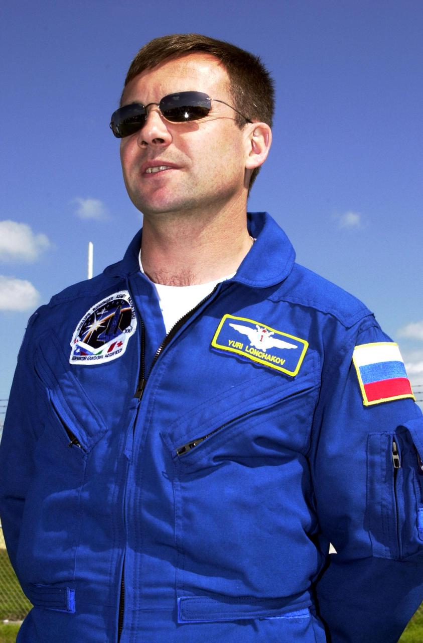 KENNEDY SPACE CENTER, FLA. -- STS-100 Mission Specialist Yuri V. Lonchakov stands near Launch Pad 39A to greet family and friends. Lonchakov is with the Russian Aviation and Space Agency. The crew is at KSC to complete final flight plan reviews in anticipation of launch. The 11-day mission to the International Space Station will deliver and integrate the Spacelab Logistics Pallet_Launch Deployment Assembly, which includes the Space Station Remote Manipulator system and the UHF Antenna, and the Multi-Purpose Logistics Module Raffaello. The mission includes two planned spacewalks for installation of the SSRMS. The mission is also the inaugural flight of the MPLM Raffaello, carrying resupply stowage racks and resupply_return stowage platforms. Liftoff on mission STS-100 is scheduled at 2:41 p.m. EDT April 19