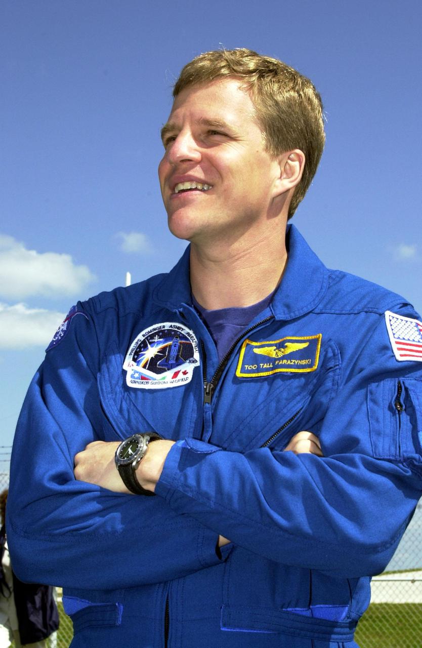 KENNEDY SPACE CENTER, FLA. -- STS-100 Mission Specialist Scott E. Parazynski stands near Launch Pad 39A to greet family and friends. The crew is at KSC to complete final flight plan reviews in anticipation of launch. The 11-day mission to the International Space Station will deliver and integrate the Spacelab Logistics Pallet_Launch Deployment Assembly, which includes the Space Station Remote Manipulator system and the UHF Antenna, and the Multi-Purpose Logistics Module Raffaello. The mission includes two planned spacewalks for installation of the SSRMS. The mission is also the inaugural flight of the MPLM Raffaello, carrying resupply stowage racks and resupply_return stowage platforms. Liftoff on mission STS-100 is scheduled at 2:41 p.m. EDT April 19