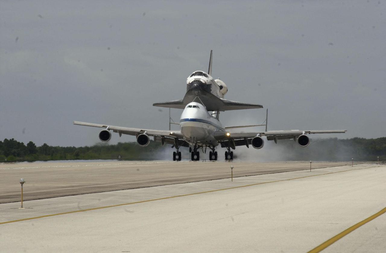 KENNEDY SPACE CENTER, FLA. -- Orbiter Endeavour returns to KSC’s Shuttle Landing Facility mounted atop NASA’s Shuttle Carrier Aircraft. The duo completed a two-day transcontinental ferry flight from Edwards Air Force Base, Calif. Endeavour landed at Edwards AFB after a 12-day mission, STS-100, to the International Space Station. Endeavour will be towed to the Orbiter Processing Facility bay 1 where it will begin processing for mission STS-108