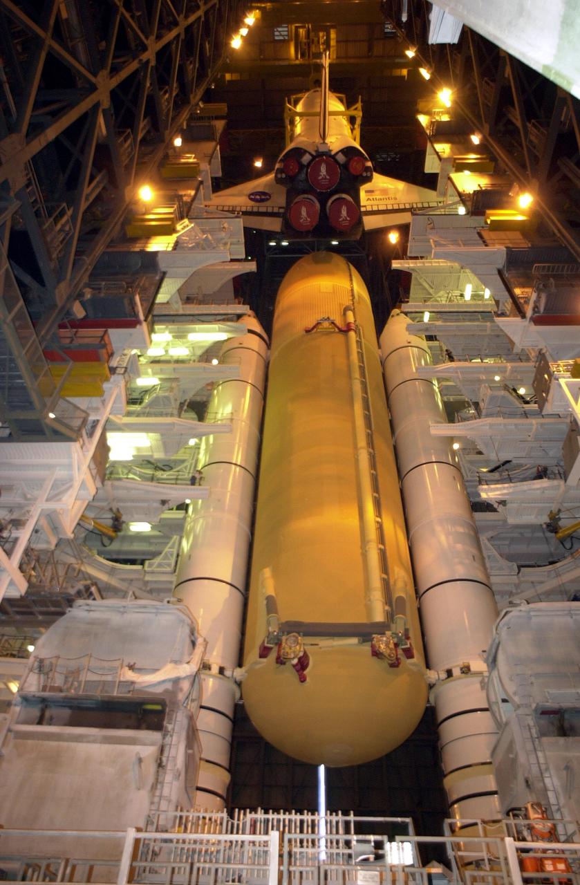 KENNEDY SPACE CENTER, FLA. -- In Vehicle Assembly Building high bay 1, the orbiter Atlantis is being lowered into position for mating to its external tank_solid rocket booster stack.; Space Shuttle Atlantis is scheduled to launch on mission STS-104 in early July