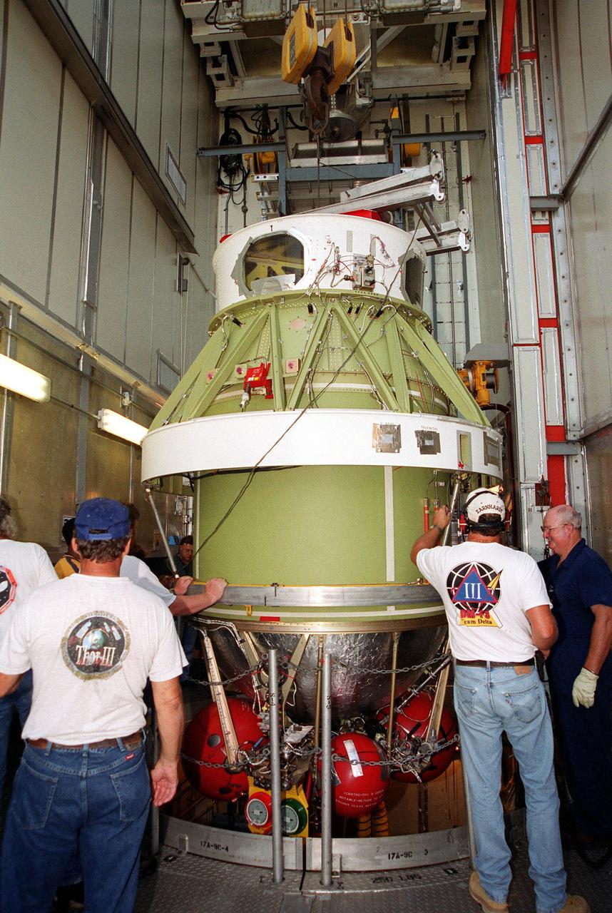 KENNEDY SPACE CENTER, Fla. -- The second stage of a Delta II rocket is moved into position on the gantry on Launch Complex 17-A, Cape Canaveral Air Force Station, for mating with the first stage. The Delta II will propel the Genesis spacecraft on a journey to capture samples of the ions and elements in the solar wind and return them to Earth for scientists to use to determine the exact composition of the Sun and the solar system’s origin. NASA’s Genesis project in managed by the Jet Propulsion Laboratory in Pasadena, Calif. Lockheed Martin Astronautics built the Genesis spacecraft for NASA in Denver, Colo. The launch is scheduled for July 30 at 12:36 p.m. EDT