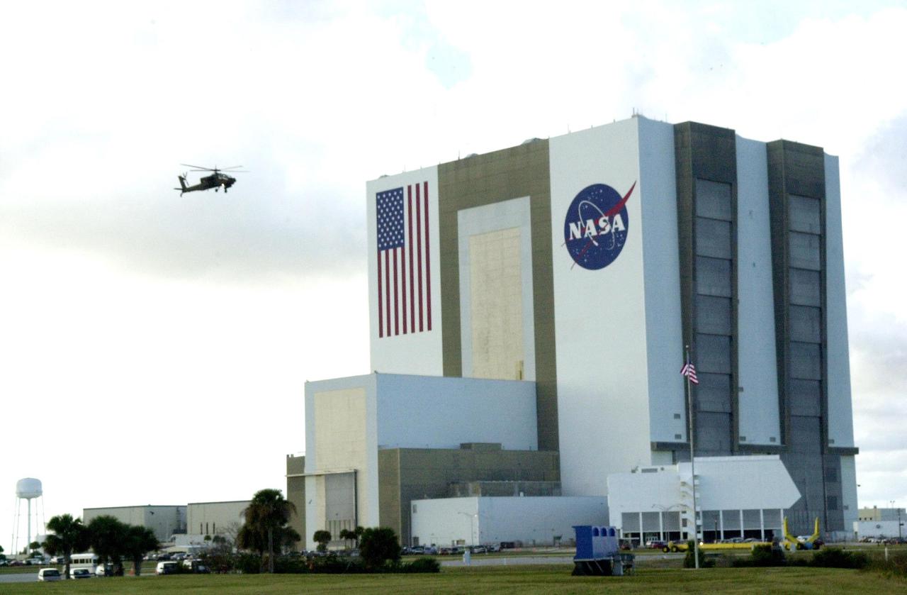 KENNEDY SPACE CENTER, FLA. -- A United States military Apache H64A helicopter patrols Kennedy Space Center airspace near the Vehicle Assembly Building as the launch of Space Shuttle Endeavour on mission STS-108 to the International Space Station approaches.  Launch is scheduled for 7:41 p.m. EST on Nov. 29