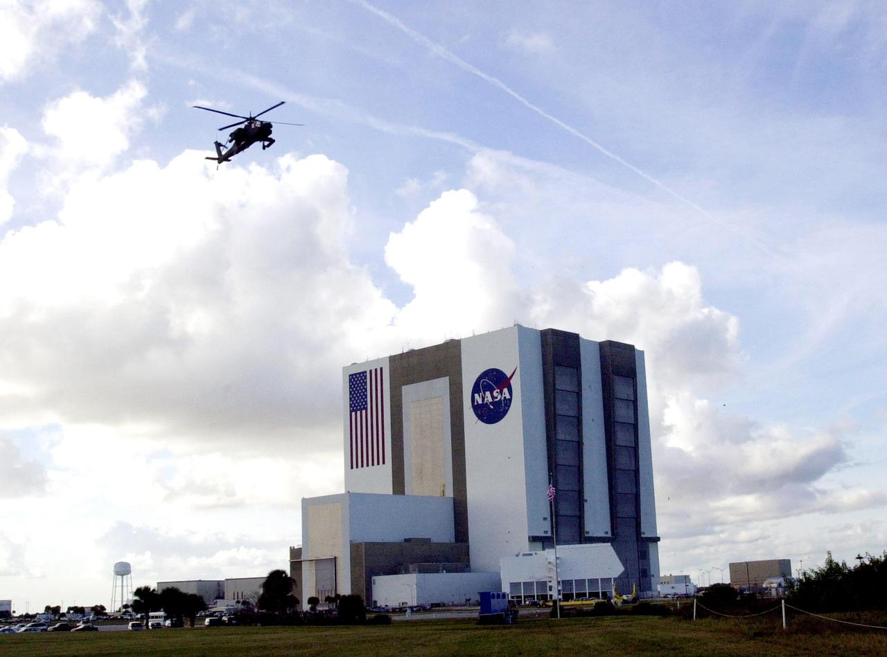 KENNEDY SPACE CENTER, FLA. -- A United States military Apache H64A helicopter patrols Kennedy Space Center airspace near the Vehicle Assembly Building as the launch of Space Shuttle Endeavour on mission STS-108 to the International Space Station approaches.  Launch is scheduled for 7:41 p.m. EST on Nov. 29