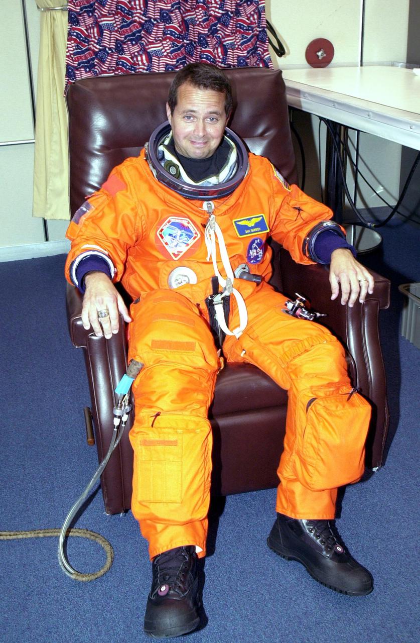 KENNEDY SPACE CENTER, Fla. -- Expedition 4 crew member Daniel W. Bursch waits patiently for final checkout of his launch and entry suit prior to heading to Launch Pad 39B and Space Shuttle Endeavour. Top priorities for the 11-day STS-108 (UF-1) mission of Endeavour are rotation of the International Space Station Expedition 3 and Expedition 4 crews; bringing water, equipment and supplies to the station in the Multi-Purpose Logistics Module Raffaello; and the crew's completion of robotics tasks and a spacewalk to install thermal blankets over two pieces of equipment at the bases of the Space Station's solar wings. Launch is scheduled for 5:45 p.m. EST Dec. 4, 2001, from Launch Pad 39B