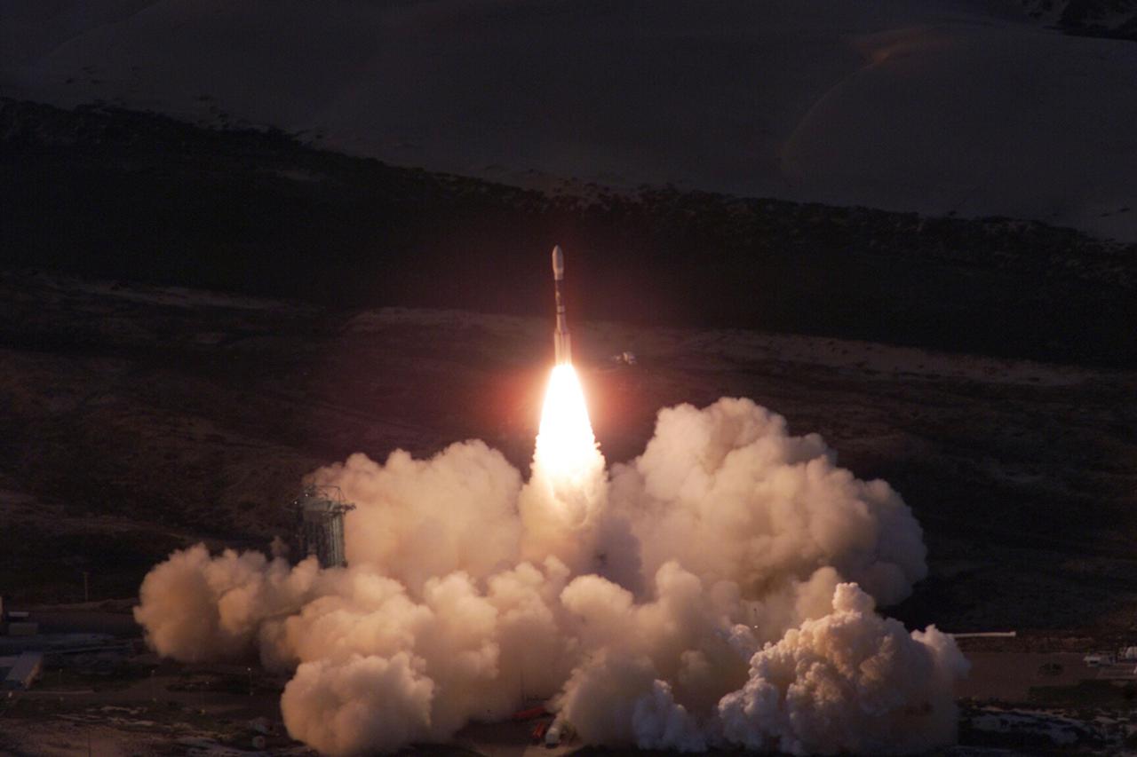 VANDENBERG AIR FORCE BASE, Calif. -- A Delta II rocket appears to erupt from the undulating clouds of smoke below as it launches with the joint NASA_French Space Agency oceanography satellite Jason 1 and Thermosphere Ionosphere Mesosphere Energetics and Dynamics satellite aboard. Liftoff from Launch Complex 2W occurred at 7:07 a.m. PST (10:07 a.m. EST or 15:07 GMT). Jason 1 joins the orbiting Topex_Poseidon satellite to continue observations of the global climate interaction occurring between the sea and the atmosphere as a result of stored solar energy. Instruments on Jason 1 will map variations in ocean surface topography to monitor world ocean circulation, study interactions of the oceans and atmosphere, improve climate predictions and observe events like El Nino. The mission is expected to last three years. The TIMED satellite will study a little-known region above the atmosphere, some 40 to 110 miles from the Earth's surface. Studying this region has been nearly impossible until now because conventional airplanes and balloons cannot reach this high altitude, and it is too low for direct satellite measurements