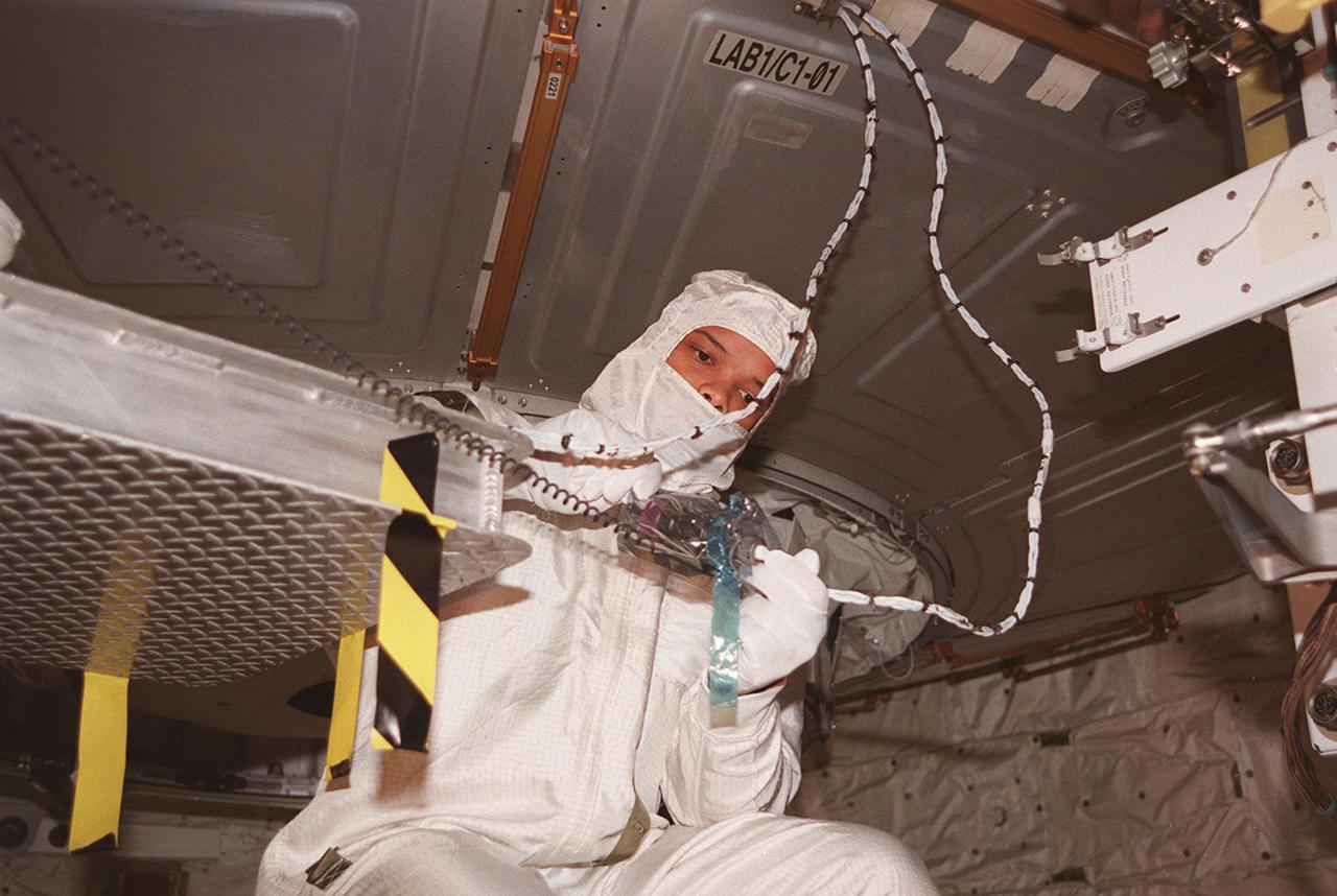 KENNEDY SPACE CENTER, FLA. -- In the payload bay of the orbiter Atlantis, STS-98 Mission Specialist Robert Curbeam works with equipment he will use in space to attach the U.S. Lab Destiny to the International Space Station. The crew is at KSC for Terminal Countdown Demonstration Test activities, which also include a simulated launch countdown. A key element in the construction of the International Space Station, Destiny is a pressurized module designed to accommodate pressurized payloads. It has a capacity of 24 rack locations. Payload racks will occupy 13 locations especially designed to support experiments. The module already has five system racks installed inside. Launch of STS-98 on its 11-day mission is scheduled for Jan. 19 at 2:11 a.m. EST