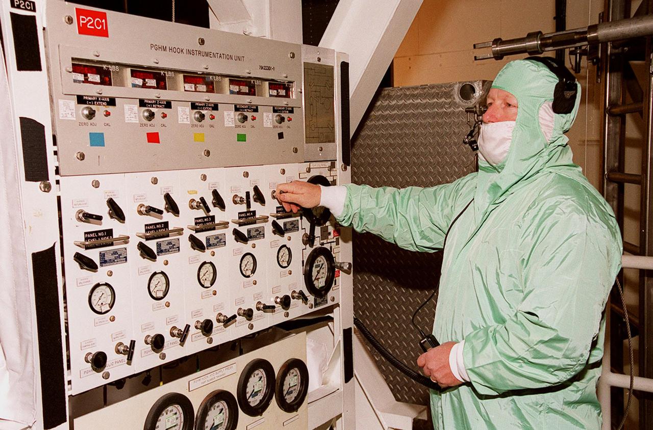KENNEDY SPACE CENTER, FLA. -- In the Payload Changeout Room at Launch Pad 39A, a technician works switches on the Payload Ground-Handling Mechanism hook instrumentation unit that will move the U.S. Lab Destiny out of the payload canister and into the PCR. Destiny will then be transferred to the payload bay of Atlantis for mission STS-98. Destiny, a key element in the construction of the International Space Station is designed for space science experiments. STS-98 is the seventh construction flight to the ISS. Launch of STS-98 is scheduled for Jan. 19 at 2:11 a.m. EST