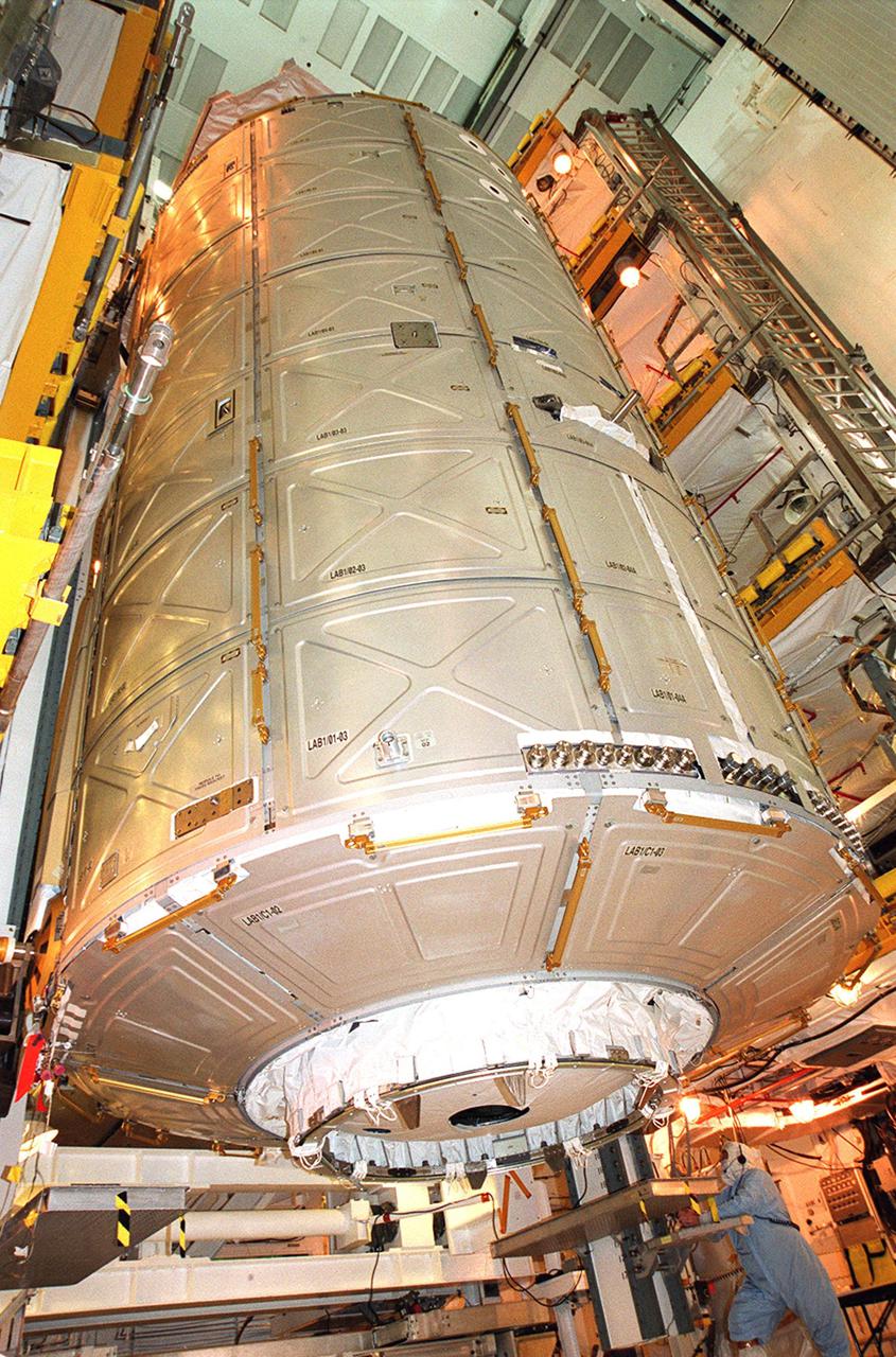 The U.S. Lab Destiny moves out of Atlantis’ payload bay and into the Payload Changeout Room via the Payload Ground Handling Mechanism. Destiny will remain in the PCR while Atlantis rolls back to the Vehicle Assembly Building to allow workers to conduct inspections, continuity checks and X-ray analysis on the 36 solid rocket booster cables located inside each booster’s system tunnel. An extensive evaluation of NASA’s SRB cable inventory revealed conductor damage in four (of about 200) cables on the shelf. Shuttle managers decided to prove the integrity of the system tunnel cables already on Atlantis