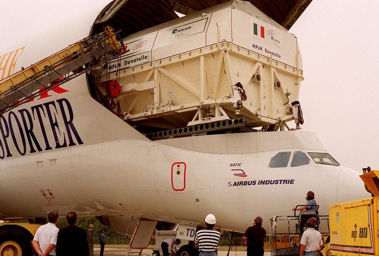 At the KSC <a href='.._.._subjects_slf.htm'> Shuttle Landing Facility<_a>, the Italian Space Agency’s <a href='.._.._subjects_mplm.htm'> Multi-Purpose Logistics Module<_a> Donatello rolls out of the Airbus “Beluga” air cargo plane that brought it from the factory of Alenia Aerospazio in Turin, Italy. The third of three for the International Space Station, the module will be transported to the <a href='.._.._subjects_sspf.htm'> Space Station Processing Facility<_a> for processing. Among the activities for the payload test team are integrated electrical tests with other Station elements in the SSPF, leak tests, electrical and software compatibility tests with the Space Shuttle (using the Cargo Integrated Test equipment) and an Interface Verification Test once the module is installed in the Space Shuttle’s payload bay at the launch pad. The most significant mechanical task to be performed on Donatello in the SSPF is the installation and outfitting of the racks for carrying the various experiments and cargo