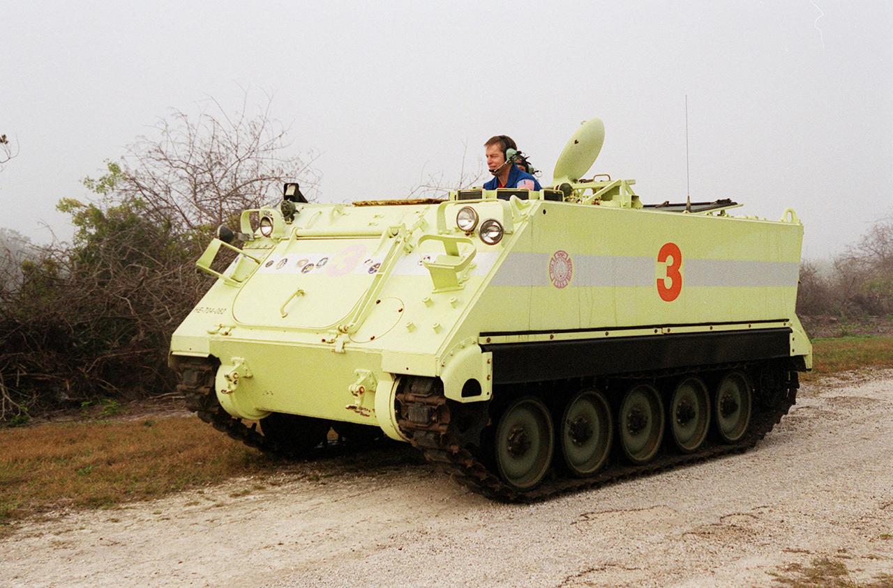 STS-102 Commander James Wetherbee drives the M-113 armored carrier that the crew could use to exit the pad if an emergency ever occurred prior to launch. The STS-102 crew is at KSC to take part in Terminal Countdown Demonstration Test activities, which also include a simulated launch countdown. STS-102 is the eighth construction flight to the International Space Station, carrying as payload the Multi-Purpose Logistics Module Leonardo. Launch on mission STS-102 is scheduled for March 8