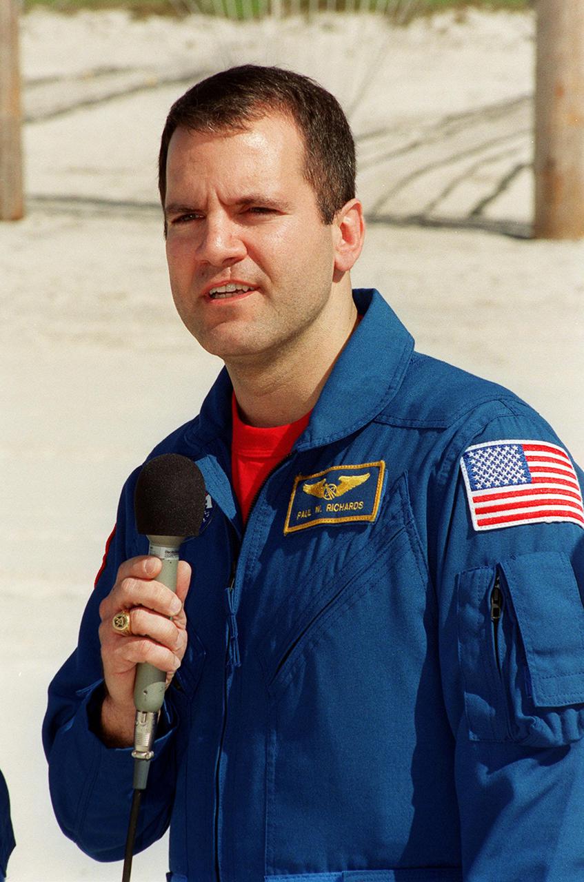 STS-102 Mission Specialist Paul Richards answers a question from the media during an interview session at the slidewire basket landing near Launch Pad 39B. He and other crew members are at KSC for Terminal Countdown Demonstration Test activities, which also include a simulated launch countdown. STS-102 is the eighth construction flight to the International Space Station, with Space Shuttle Discovery carrying the Multi-Purpose Logistics Module Leonardo. Discovery will also be transporting the Expedition Two crew to the Space Station, to replace Expedition One, who will return to Earth with Discovery. Launch on mission STS-102 is scheduled for March 8