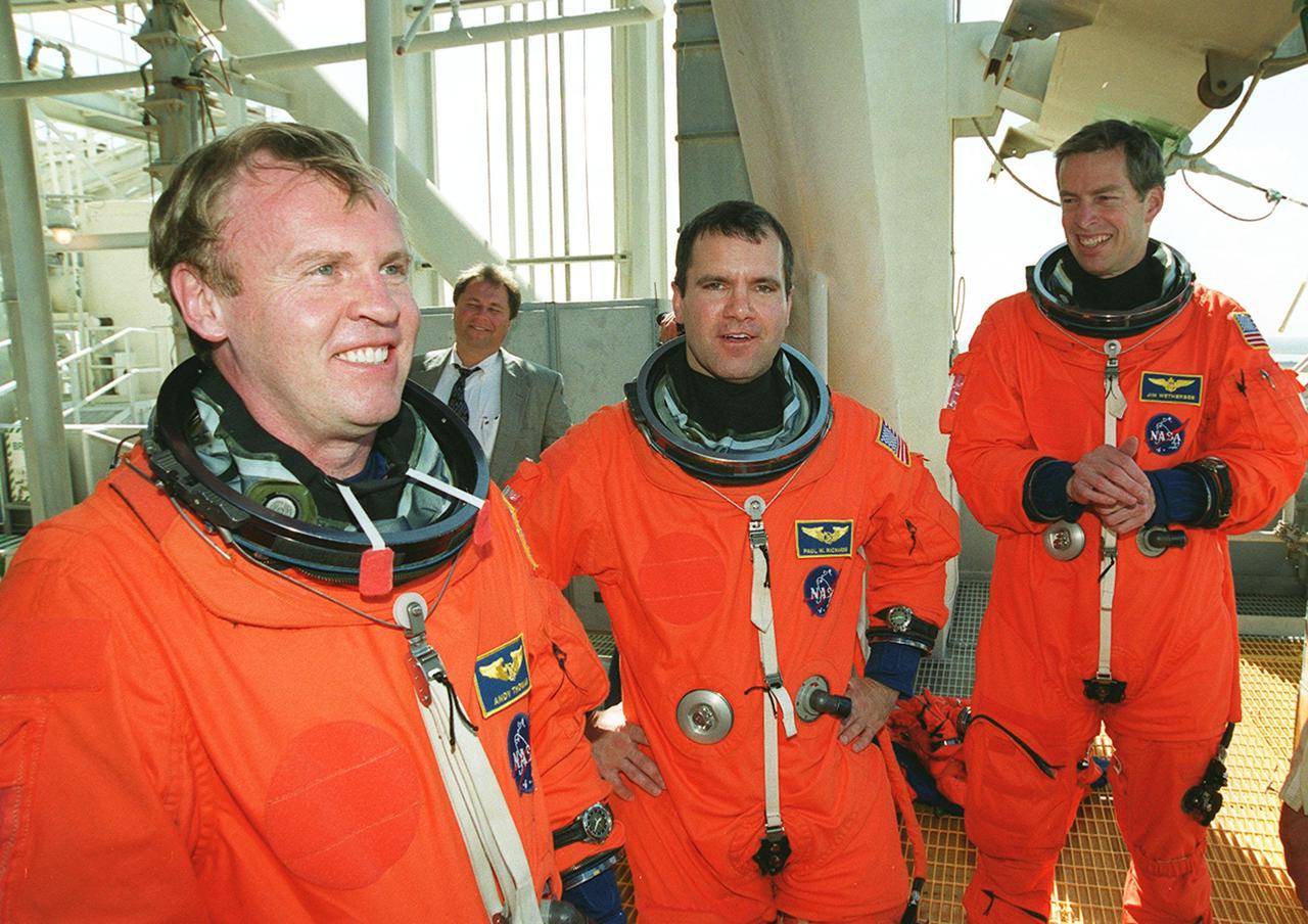 Relaxing after emergency escape training on the 195-foot level of the Fixed Service Structure, Launch Pad 39B, are(left to right) STS-102 Mission Specialists Andrew Thomas and Paul Richards and Commander James Wetherbee. The crew is at KSC for Terminal Countdown Demonstration Test activities, which include the emergency training and a simulated launch countdown. STS-102 is the eighth construction flight to the International Space Station, with Space Shuttle Discovery carrying the Multi-Purpose Logistics Module Leonardo. Also flying on the mission are the Expedition Two crew, who will replace the Expedition One crew on Space Station. Expedition One will return to Earth with Discovery. Launch on mission STS-102 is scheduled for March 8