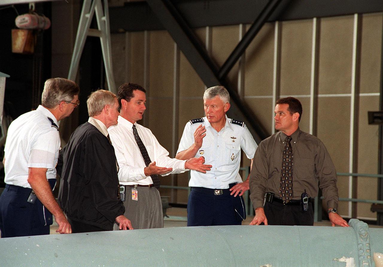 Inside the Vehicle Assembly Building, Director of Shuttle Processing relates information about the launch process to (left to right) Brig. Gen. Donald Pettit, Commander of the 45th Space Wing, Cape Canaveral; Roy Bridges, KSC’s Center Director; King; Gen. Ralph Everhart, Commander, Space Command; and Dave Rainer