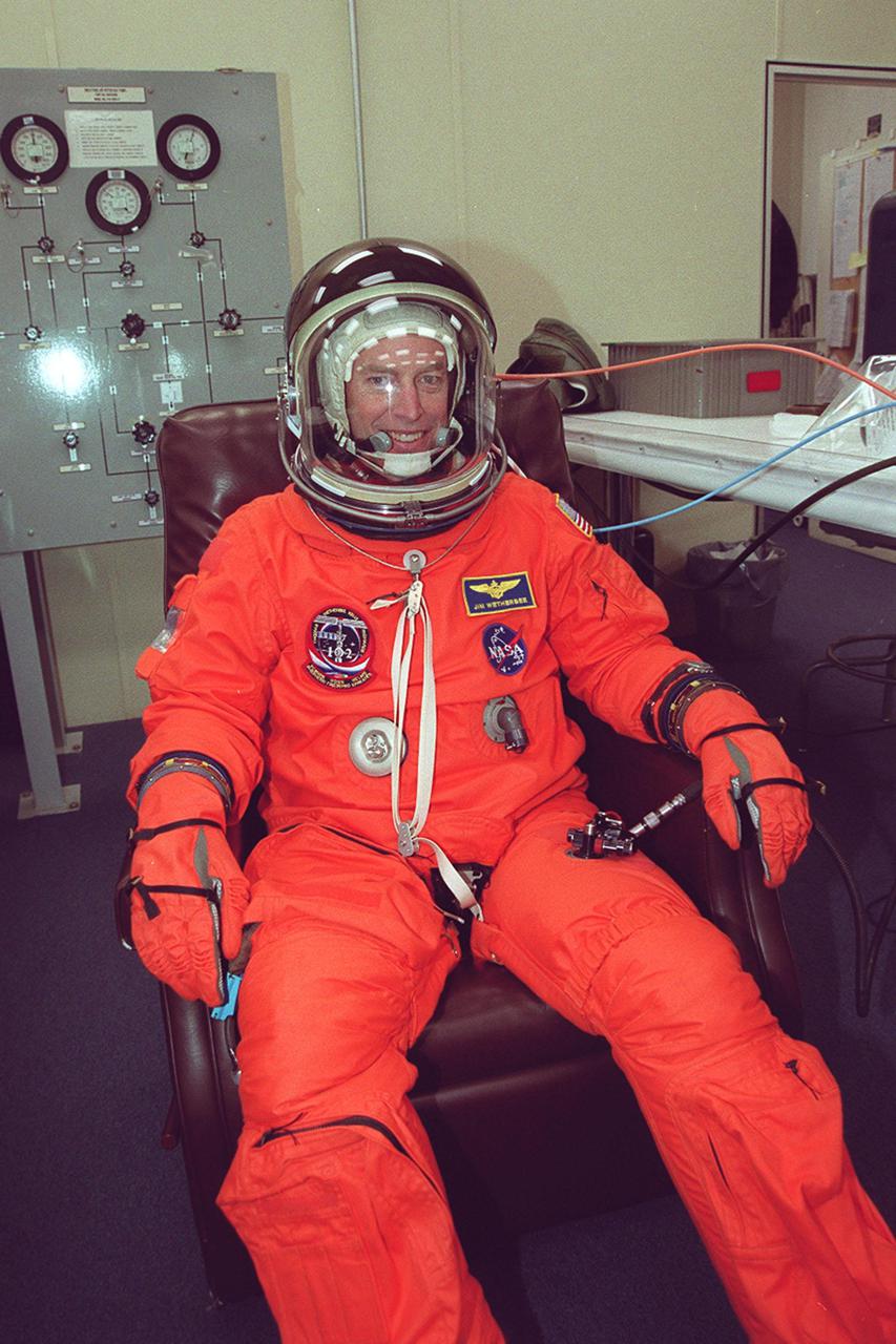 STS-102 Commander James Wetherbee gets final adjustments on his launch and entry suit before heading to Space Shuttle Discovery on Launch Pad 39B. This mission is Wetherbee’s fifth Shuttle flight. Discovery is scheduled to launch March 8 at 6:42 a.m. EST, carrying the Multi-Purpose Logistics Module Leonardo to the International Space Station. The primary delivery system used to resupply and return Station cargo requiring a pressurized environment, Leonardo will deliver up to 10 tons of laboratory racks filled with equipment, experiments and supplies for outfitting the newly installed U.S. Laboratory Destiny. In addition, three crew members Mission Specialists James Voss, Susan Helms and Russian cosmonaut Yury Usachev are the Expedition Two crew replacing Expedition One on the Station. Discovery is expected to land at KSC on March 20 at 2:02 a.m