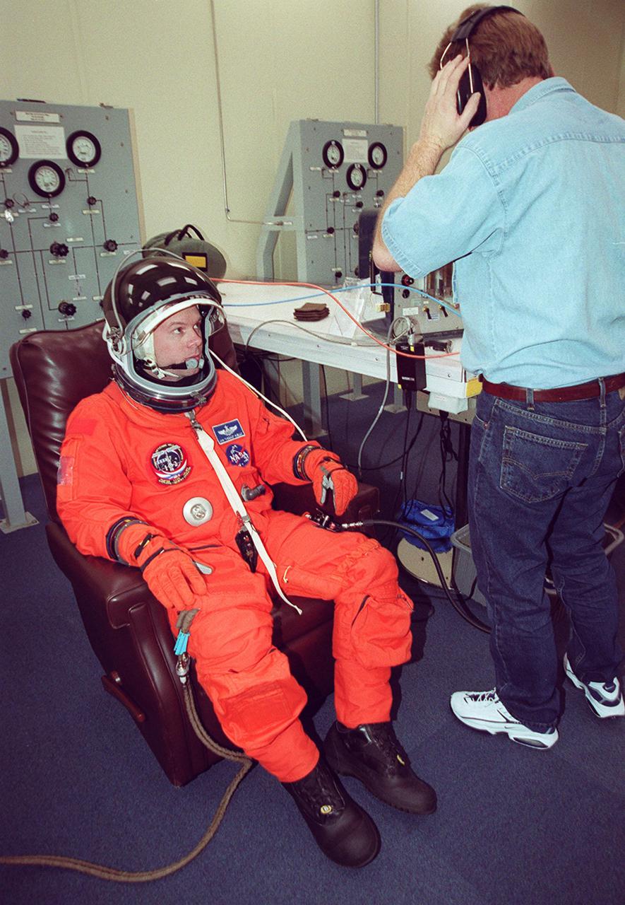 STS-102 Pilot James Kelly gets a final fitting in his launch and entry suit. This will be Kelly’s first Shuttle launch. . STS-102 is the eighth construction flight to the International Space Station, carrying the Multi-Purpose Logistics Module Leonardo. The primary delivery system used to resupply and return Station cargo requiring a pressurized environment, Leonardo will deliver up to 10 tons of laboratory racks filled with equipment, experiments and supplies for outfitting the newly installed U.S. Laboratory Destiny. In addition, three of the crew members Mission Specialists James Voss, Susan Helms and Yury Usachev, known as Expedition Two are flying to the Station to replace Expedition One, who will return to Earth on Discovery. Discovery is set to launch March 8 at 6:42 a.m. EST. The 12-day mission is expected to end with a landing at KSC on March 20