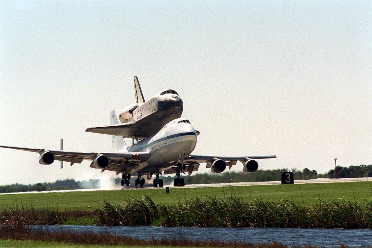 The orbiter Atlantis arrives at KSC’s Shuttle Landing Facility riding piggyback on a Shuttle Carrier Aircraft, a modified Boeing 747. Atlantis landed in California Feb. 19 concluding mission STS-98. The ferry flight began in California March 1; unfavorable weather conditions kept it on the ground at Altus AFB, Okla., until it could return to Florida. The orbiter will next fly on mission STS-104, the 10th construction flight to the International Space Station, scheduled June 8