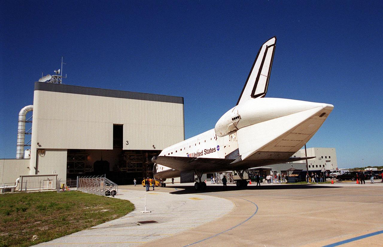KENNEDY SPACE CENTER, FLA. -- Atlantis heads for the open doors of the Orbiter Processing Facility bay 2 where it will undergo preparations for launch. Atlantis returned from California atop a Shuttle Carrier Aircraft after its Feb. 19 landing at Edwards Air Force Base, concluding mission STS-98. The ferry flight began March 1; unfavorable weather conditions kept it on the ground at Altus AFB, Okla., until it could return to Florida. In the Orbiter Processing Facility, Atlantis will be prepared for mission STS-104, the 10th construction flight to the International Space Station, scheduled to launch June 8