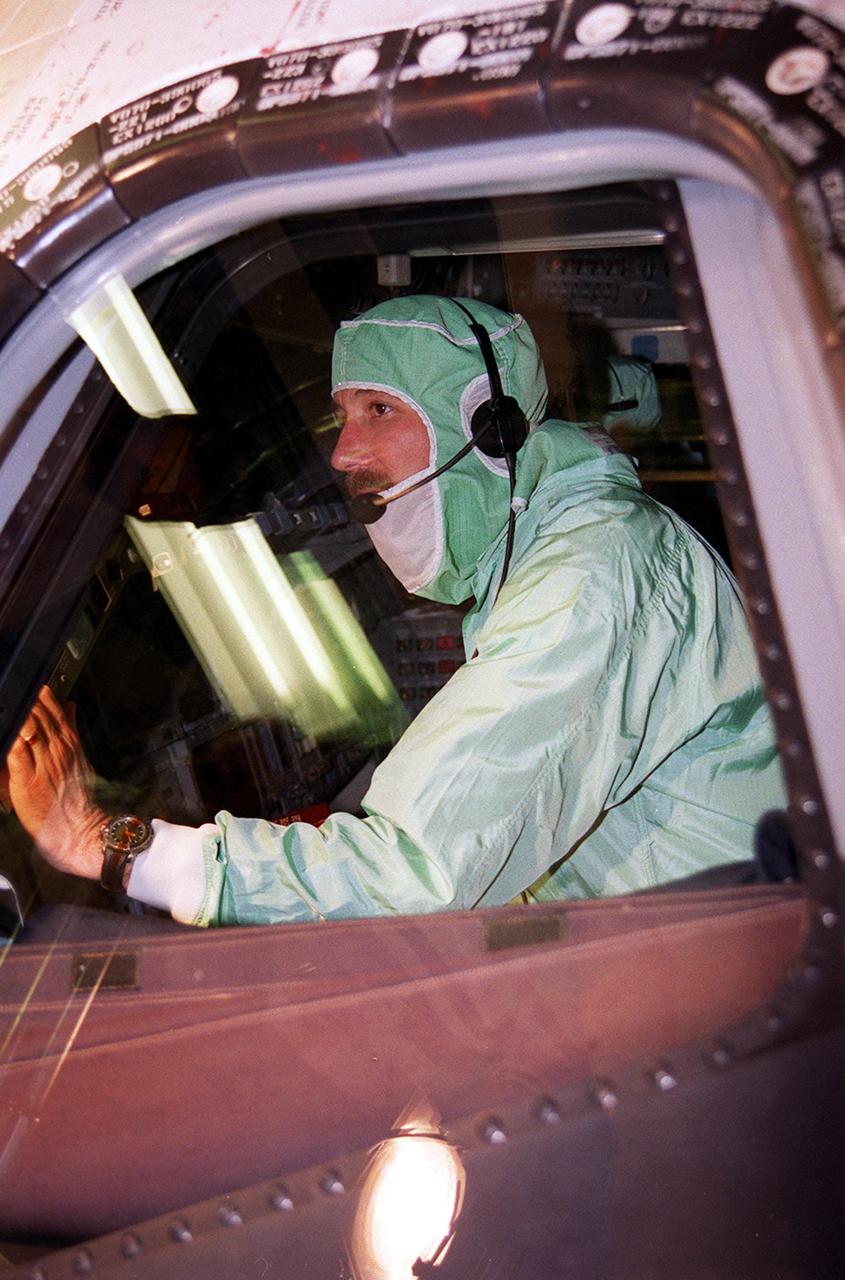 During a Crew Equipment Interface Test (CEIT) at KSC, STS-100 Commander Kent V. Rominger checks out the windshield in orbiter Endeavour. Other crew members at KSC for the CEIT are Pilot Jeffrey S. Ashby and Mission Specialists Chris Hadfield, who is with the Canadian Space Agency, Scott Parazynski, John L. Phillips, Umberto Guidoni, who is with the European Space Agency, and Yuri Lonchakov, who is with the Russian Aviation and Space Agency. The orbiter is carrying the Multi-Purpose Logistics Module Raffaello and the Canadian robotic arm, SSRMS, to the International Space Station. Raffaello carries six system racks and two storage racks for the U.S. Lab. Launch of mission STS-100 is scheduled for April 19 at 2:41 p.m. EDT from Launch Pad 39A