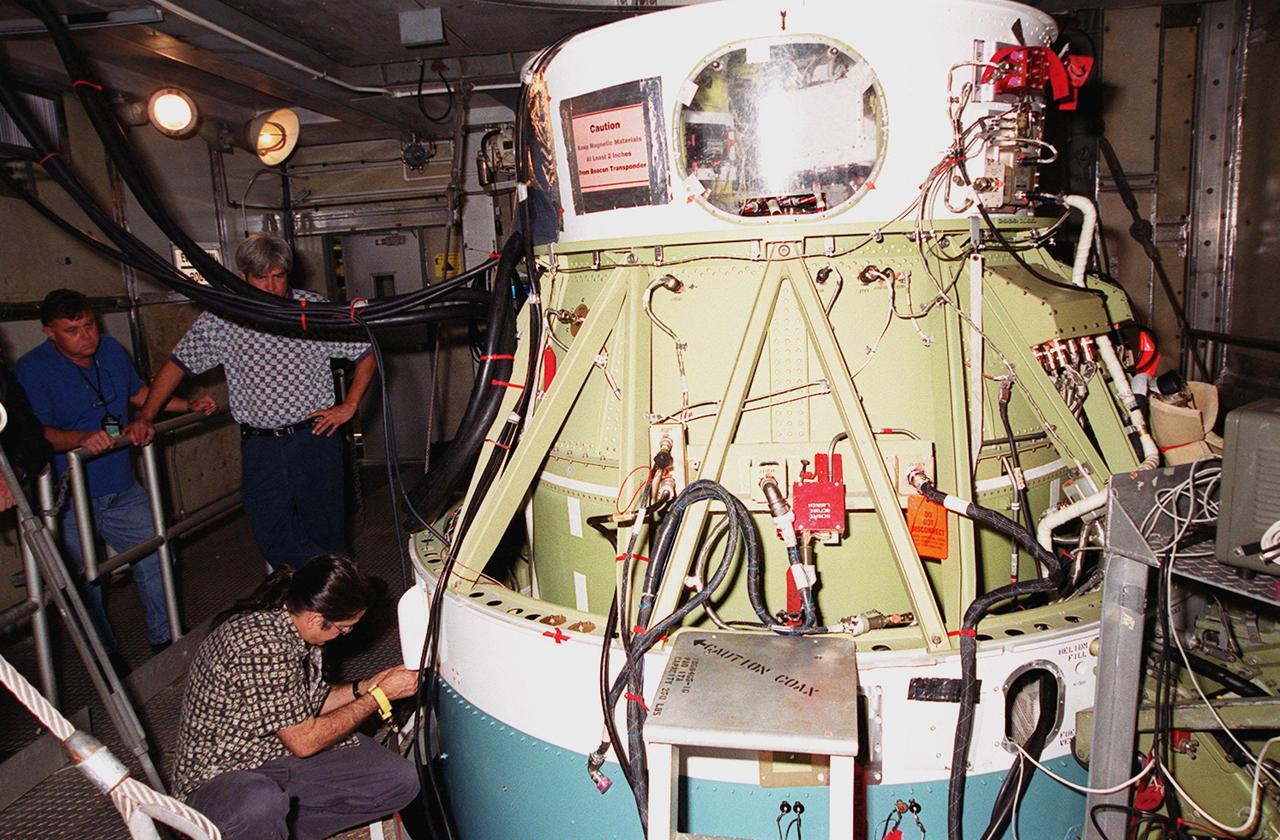 At Launch Pad 17-A, Cape Canaveral Air Force Station, a worker prepares the site before attaching a camera to the second stage of the Delta II rocket for the Mars Odyssey launch. The orbiter carries three science instruments THEMIS, the Gamma Ray Spectrometer (GRS), and the Mars Radiation Environment Experiment (MARIE) that will map the mineralogy and morphology of the Martian surface. The Mars Odyssey Orbiter is scheduled for launch on April 7, 2001