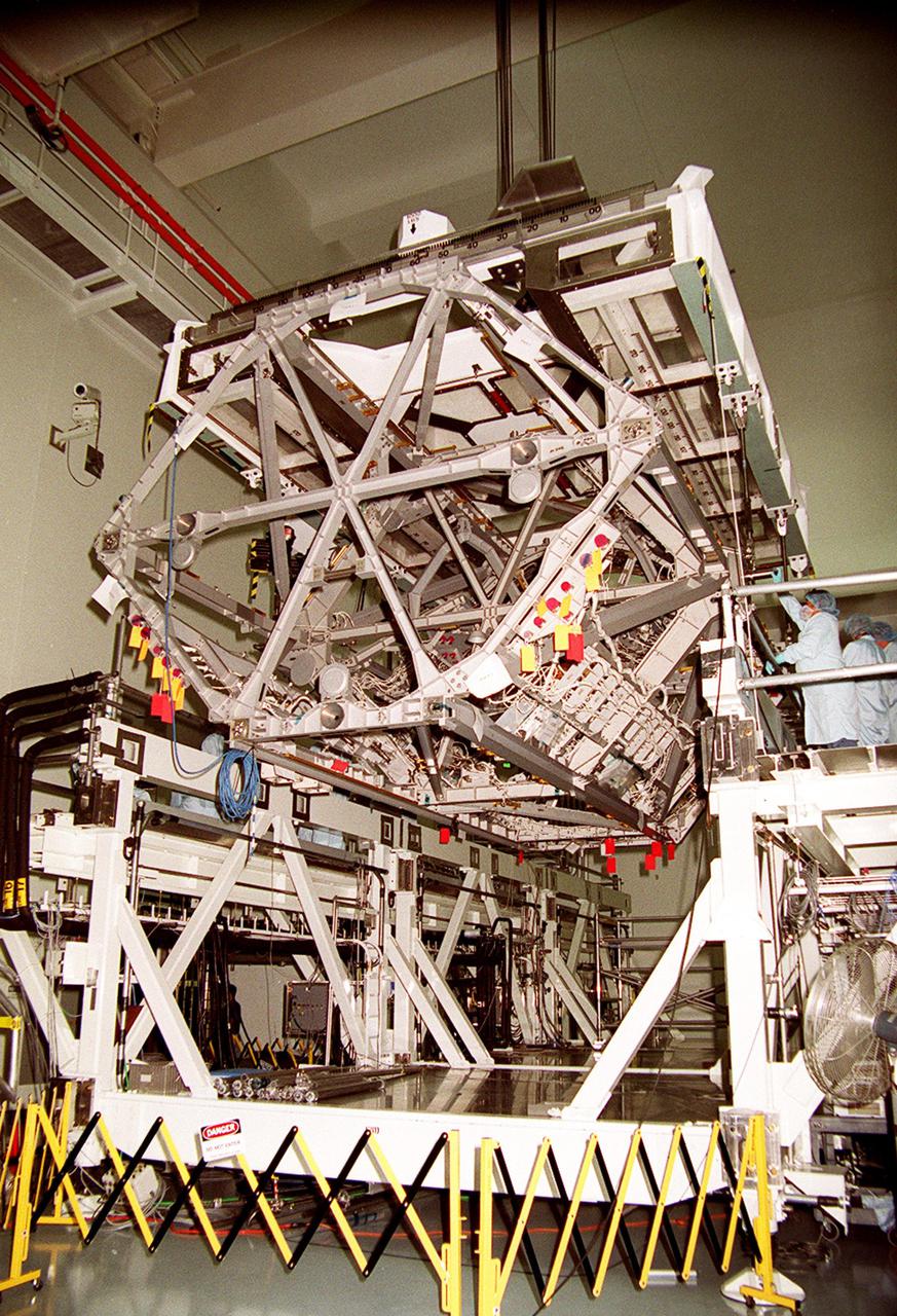 KENNEDY SPACE CENTER, FLA. -- The P3 Integrated Truss Structure is lowered onto a workstand in the Space Station Processing Facility. The port-side P3 truss is scheduled to be added to the International Space Station on mission STS-115 in 2002 aboard Space Shuttle Atlantis. The P3 will be attached to the first port truss segment, P1, being installed in an earlier mission