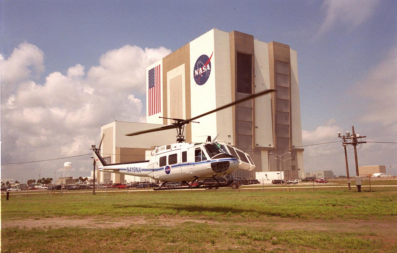 KENNEDY SPACE CENTER, FLA. -- A medevac helicopter lifts off form the site of a staged mass casualty exercise in the Launch Complex 39 area. The Vehicle Assembly Building is seen in the background. Employees are playing roles in the fictitious sniper attack that is being staged to validate capabilities of KSC’s fire, medical, helicopter transport and security personnel to respond to such an event