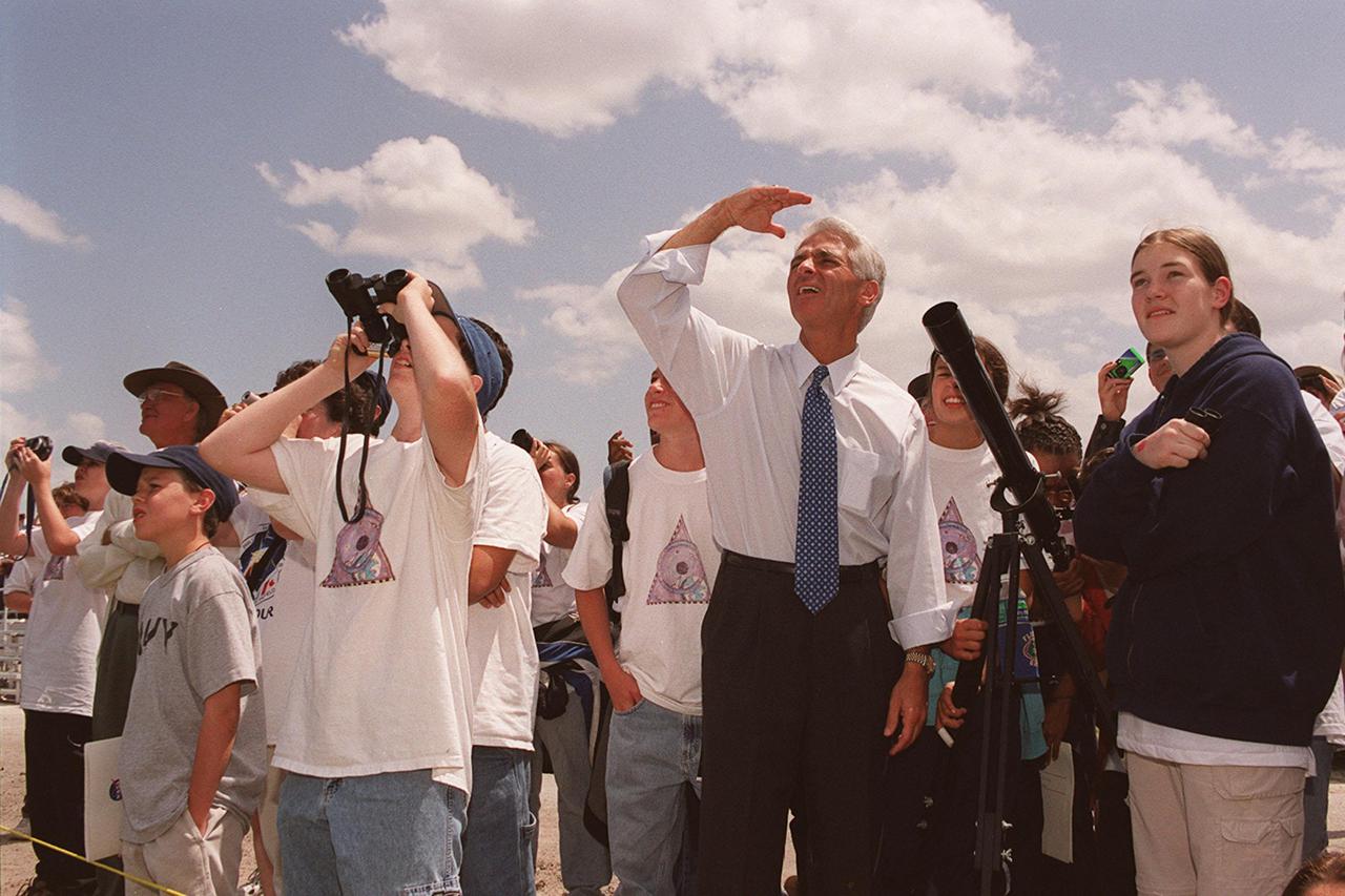 KENNEDY SPACE CENTER, FLA. -- Students from Ronald McNair Magnet School, Cocoa, Fla.,; excitedly watch the launch of  Space Shuttle Endeavour on mission STS-100 in the company of the State Commissioner of Education Charlie Crist (center).  Crist was commemorating the 20th anniversary of Space Shuttle program with his visit to KSC for the launch