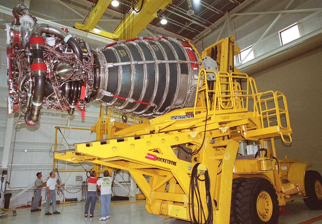 KENNEDY SPACE CENTER, FLA. -- A new block 2 engine is ready for its move to Orbiter Processing Facility bay 3. There it will be installed on the orbiter Atlantis, on mission STS-104, for its first flight. The Block II Main Engine configuration is manufactured by Boeing Rocketdyne in Canoga Park, Calif., and includes a new Pratt and Whitney high-pressure fuel turbo pump. Engine improvements are managed by NASA’s Marshall Space Flight Center in Huntsville, Ala. Each Space Shuttle Main Engine is 14 feet (4.3 meters) long, weighs about 7,000 pounds (3,175 kilograms), and is 7.5 feet (2.3 meters) in diameter at the end of the nozzle
