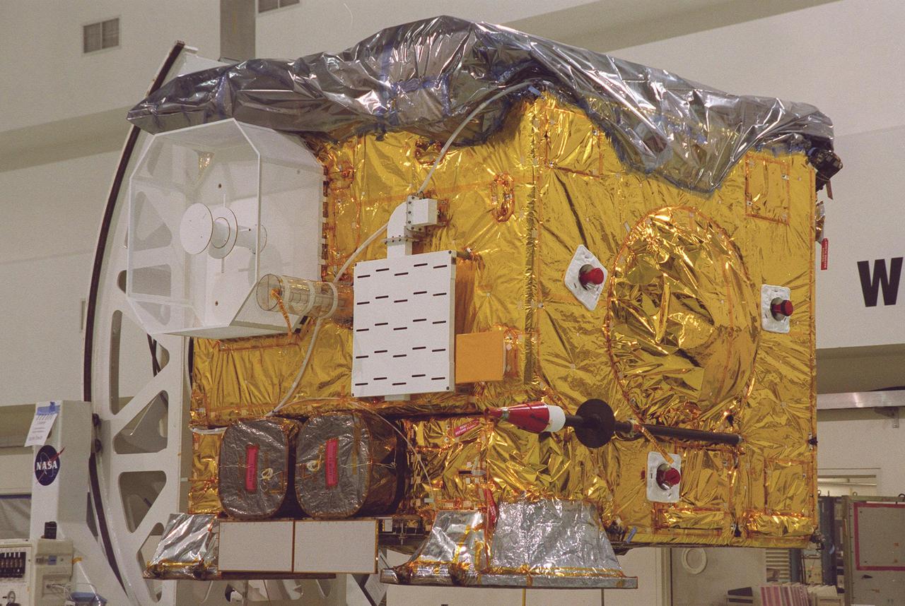 The newest Geostationary Operational Environmental Satellite-M (GOES-M) satellite is in the spotlight at Astrotech, in Titusville, for the media to see the last in the current series of advanced geostationary weather satellites in service. GOES-M has a new instrument not on earlier spacecraft, a Solar X-ray Imager that can be used in forecasting space weather, the effects of solar storms that create electromagnetic disturbances on earth that affect other satellites, communications and power grids. GOES is scheduled to launch from Cape Canaveral Air Force Station on an Atlas II rocket in July