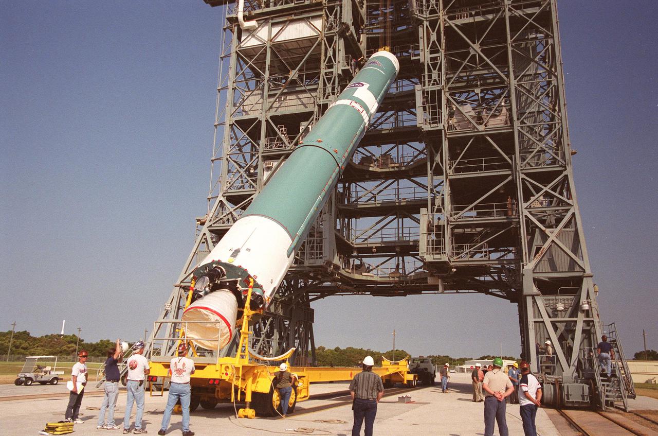 KENNEDY SPACE CENTER, FLA. --  On Launch Complex 17-B, Cape Canaveral Air Force Station, the first stage of a Boeing Delta rocket is lifted to vertical as it moves up the gantry. When fully assembled, the rocket is scheduled to launch the MAP instrument June 30 into a lunar-assisted trajectory to the Sun-Earth for a 27-month mission. MAP will measure small fluctuations in the temperature of the cosmic microwave background radiation to an accuracy of one millionth of a degree. These measurements should reveal the size, matter content, age, geometry and fate of the universe. They will also reveal the primordial structure that grew to form galaxies and will test ideas about the origins of these primordial structures. The MAP instrument will be continuously shaded from the Sun, Earth, and Moon by the spacecraft. It is a product of Goddard Space Flight Center in partnership with Princeton University