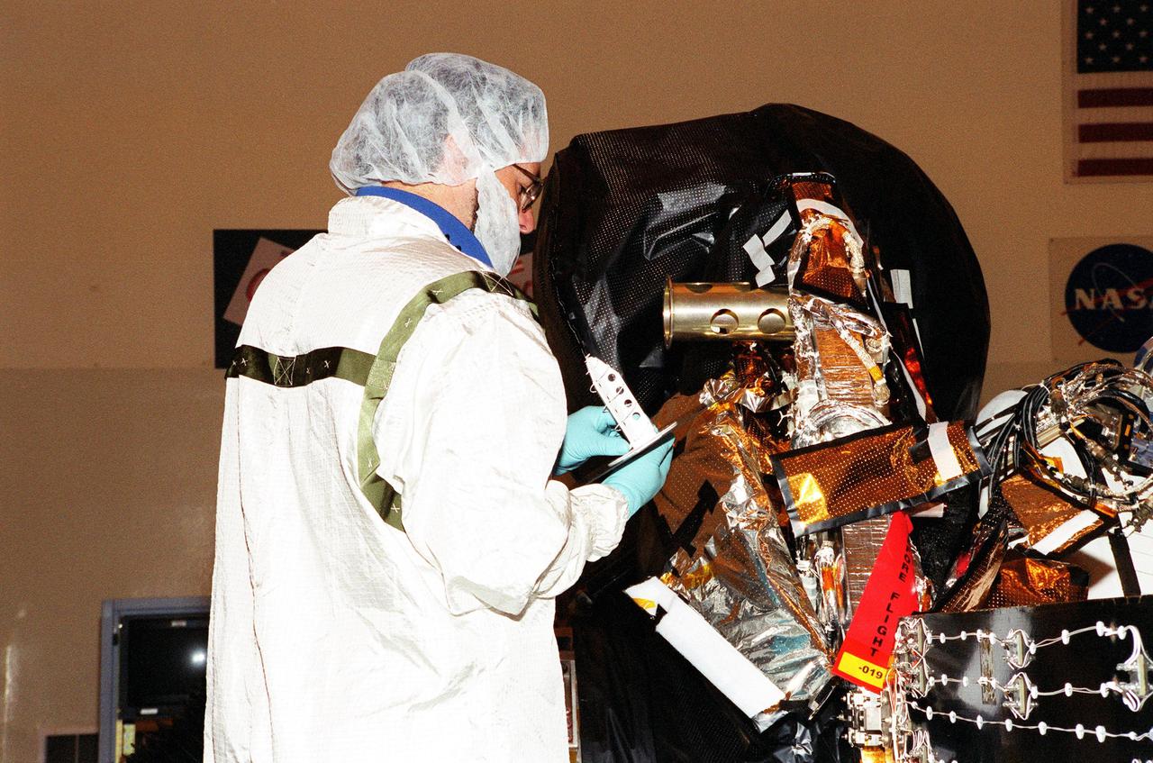 KENNEDY SPACE CENTER, Fla. -- An S-band medium gain antenna is installed on NASA's Genesis spacecraft in the Payload Hazardous Servicing Facility in KSC's industrial area.  The spacecraft is undergoing final preparations for its launch aboard a Boeing Delta II rocket on July 30 at 12:36 p.m. EDT.   Genesis will capture samples of the ions and elements in the solar wind and return them to Earth for scientists to use to determine the exact composition of the Sun and the solar system's origin. NASA's Genesis project is managed by the Jet Propulsion Laboratory in Pasadena, Calif.  Lockheed Martin Astronautics built the Genesis spacecraft for NASA in Denver, Colo