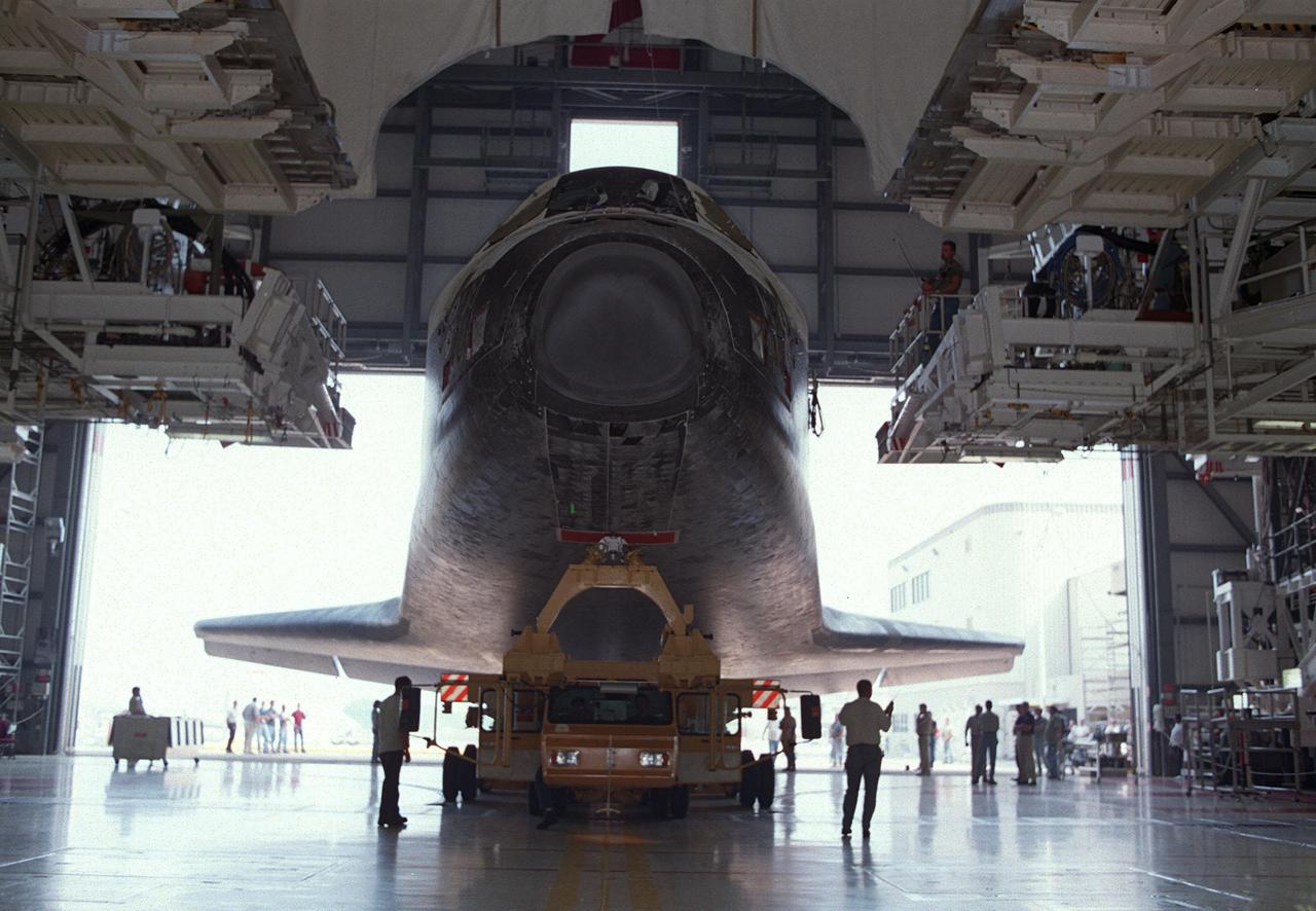 KENNEDY SPACE CENTER, Fla. -- Orbiter Discovery rolls out of Orbiter Processing Facility bay 2 atop its transporter for the short trip to the Vehicle Assembly Building. There it will be mated with its external tank and solid rocket boosters for its launch on mission STS-105. The payload on this 11th mission to the International Space Station includes the Multi-Purpose Logistics Module Leonardo, which was built by the Italian Space Agency. Leonardo will be outfitted with 12 racks of experiments and equipment. Launch of Discovery is scheduled for no earlier than Aug. 5, 2001