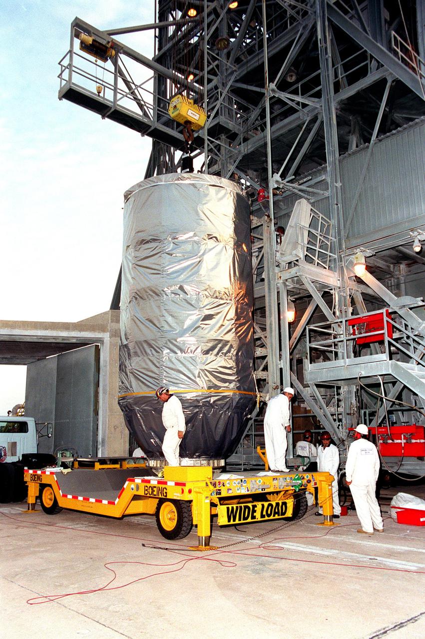 KENNEDY SPACE CENTER, Fla. -- The Microwave Anisotropy Probe (MAP) spacecraft arrives at Launch Complex 17-B, Cape Canaveral Air Force Station. MAP will be lifted up the gantry for final testing and installation of the payload fairing. Launch of MAP via a Boeing Delta II rocket is scheduled for June 30. The launch will place MAP into a lunar-assisted trajectory to the Sun-Earth for a 27-month mission. The probe will measure small fluctuations in the temperature of the cosmic microwave background radiation to an accuracy of one millionth of a degree. These measurements should reveal the size, matter content, age, geometry and fate of the universe. They will also reveal the primordial structure that grew to form galaxies and will test ideas about the origins of these primordial structures