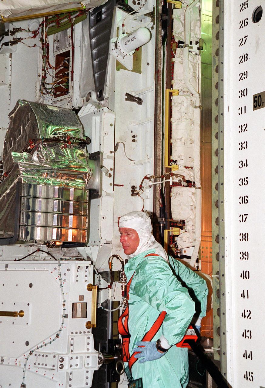 KENNEDY SPACE CENTER, Fla. -- At Launch Pad 39B, STS-104 Mission Specialist Michael L. Gernhardt pauses during payload walkdown in Atlantis’s payload bay. He and other crew members are taking part in Terminal Countdown Demonstration Test activities, which include emergency exit training from the orbiter, opportunities to inspect their mission payloads in the orbiter’s payload bay and simulated countdown exercises. The launch of Atlantis on mission STS-104 is scheduled July 12 from Launch Pad 39B. The mission is the 10th flight to the International Space Station and carries the Joint Airlock Module