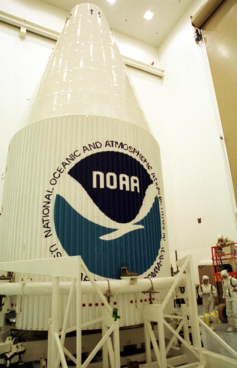 KENNEDY SPACE CENTER, Fla. -- At Astrotech, Titusville, Fla., installation of the fairing around the newest Geostationary Operational Environmental Satellite-M (GOES-M) is complete. The satellite is the last in the current series of advanced geostationary weather satellites in service. GOES-M has a new instrument not on earlier spacecraft, a Solar X-ray Imager that can be used in forecasting space weather, the effects of solar storms that create electromagnetic disturbances on earth that affect other satellites, communications and power grids. GOES is scheduled to launch from Launch Complex 36-A, Cape Canaveral Air Force Station, on an Atlas II rocket July 15