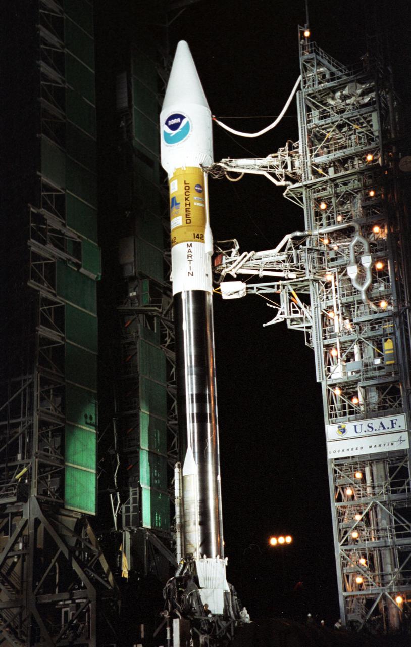 KENNEDY SPACE CENTER, Fla. -- The GOES-M satellite is poised for flight atop an Atlas II rocket at Launch Complex 36-A, Cape Canaveral Air Force Station, after rollback of the Mobile Service Tower (left). GOES-M is the last in the current series of advanced geostationary weather satellites in service. GOES-M has a new instrument not on earlier spacecraft, a Solar X-ray Imager, which can be used in forecasting space weather and the effects of solar storms. The satellite is scheduled to launch atop an Atlas rocket on July 23 during a window that extends from 3:02 to 4:26 a.m. EDT