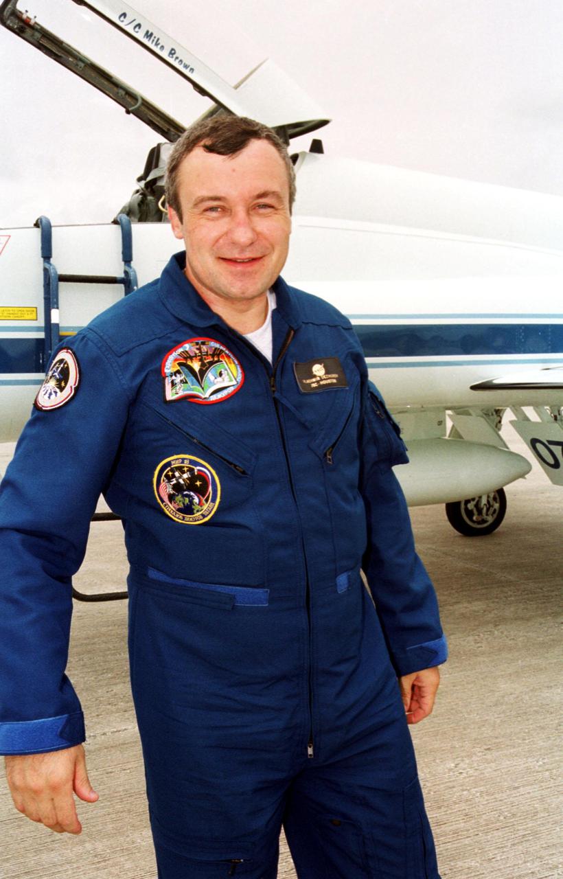 KENNEDY SPACE CENTER, Fla. -- The STS-105 and Expedition Three crews arrive at Kennedy Space Center's Shuttle Landing Facility to make final preparations for their launch to the International Space Station. Cosmonaut Vladimir Dezhurov walks away from the T-38 jet that brought him to KSC. On mission STS-105, Discovery will be transporting the Expedition Three crew and several payloads and scientific experiments to the ISS. The Early Ammonia Servicer (EAS) tank, which will support the thermal control subsystems until a permanent system is activated, will be attached to the Station during two spacewalks. The three-member Expedition Two crew will be returning to Earth aboard Discovery after a five-month stay on the Station