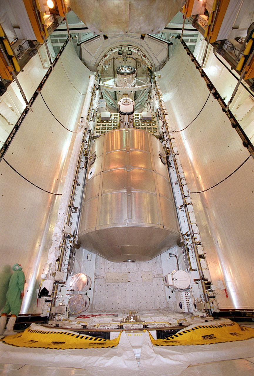 KENNEDY SPACE CENTER, Fla. -- On Launch Pad 39A, Discovery’s payload bay doors close on the payloads inside. In the center is the Multi-Purpose Logistics Module Leonardo, filled with laboratory racks of science equipment and racks and platforms of experiments and supplies. Above Leonardo is the Integrated Cargo Carrier with the Early Ammonia Servicer (EAS) in the center. The EAS contains spare ammonia for the Station’s cooling system. Ammonia is the fluid used in the radiators that cool the Station’s electronics. The EAS will be installed on the P6 truss holding the giant U.S. solar arrays, batteries and cooling radiators. Seen below the MPLM and attached on the port and starboard adapter beams are experiments. Discovery is scheduled to be launched Aug. 9, 2001