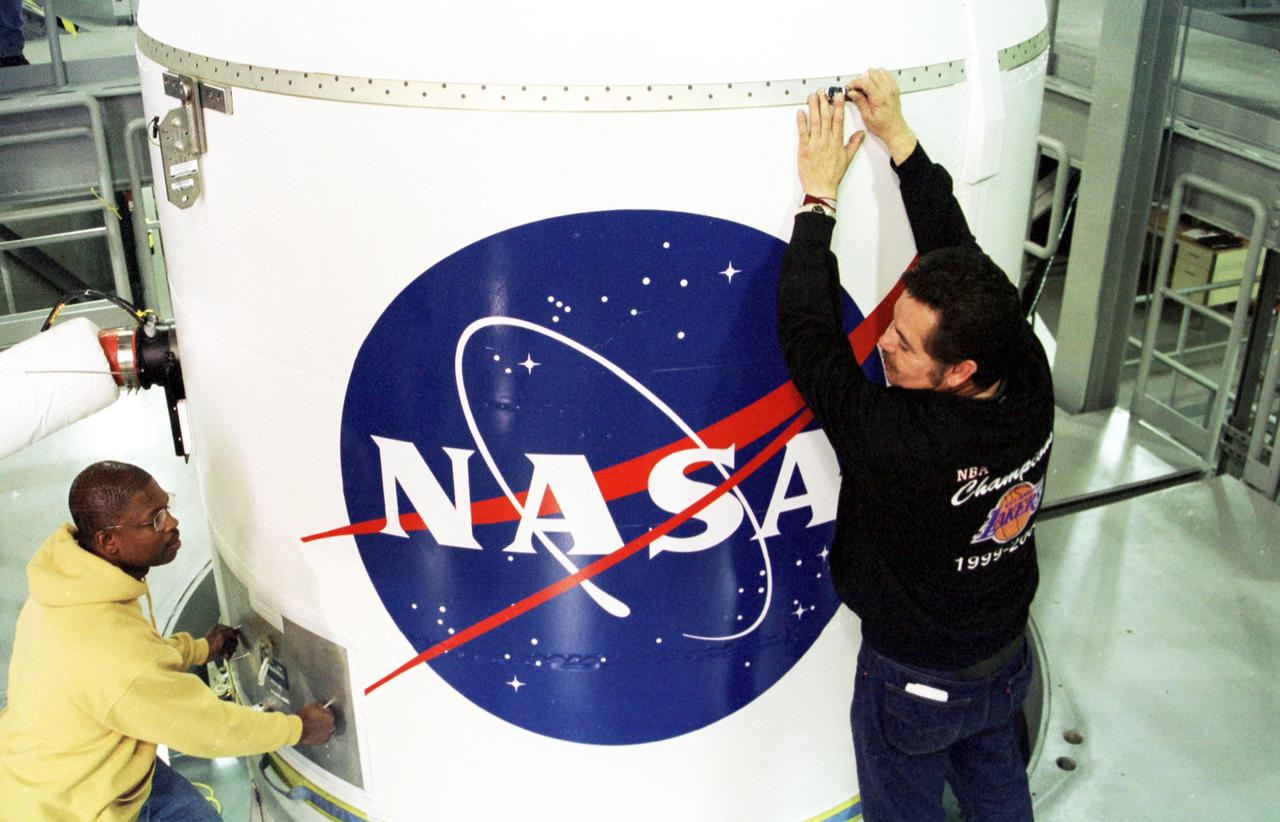 KODIAK ISLAND, Alaska -- At the Launch Service Structure, Kodiak Launch Complex (KLC), the fairing is lowered over the Kodiak Star spacecraft in preparation for launch. The first orbital launch to take place from KLC, Kodiak Star is scheduled to lift off on a Lockheed Martin Athena I launch vehicle on Sept. 17 during a two-hour window that extends from 5 p.m. ADT. The payloads aboard include the Starshine 3, sponsored by NASA, and the PICOSat, PCSat and Sapphire, sponsored by the Department of Defense (DoD) Space Test Program. KLC is the newest commercial launch complex in the United States, ideal for launch payloads requiring low-Earth polar or sun-synchronous orbits