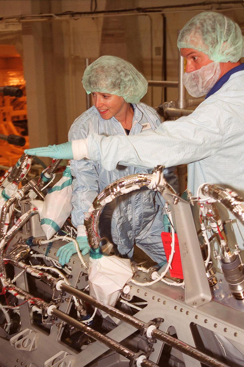KENNEDY SPACE CENTER, Fla. -- In the Operations and Checkout Bldg., STS-112 Pilot Pamela A. Melroy gets a close look at the Integrated Truss Structure (ITS) S1 that will be part of the payload on the mission.  Other members of the crew are Commander Jeffrey S. Ashby and Mission Specialists David A. Wolf, Piers J. Sellers, Sandra H. Magnus and Fyodor Nikolayevich Yurchikhin, a cosmonaut with the Russian Aviation and Space Agency.    Mission STS-112 is scheduled for launch in July 2002